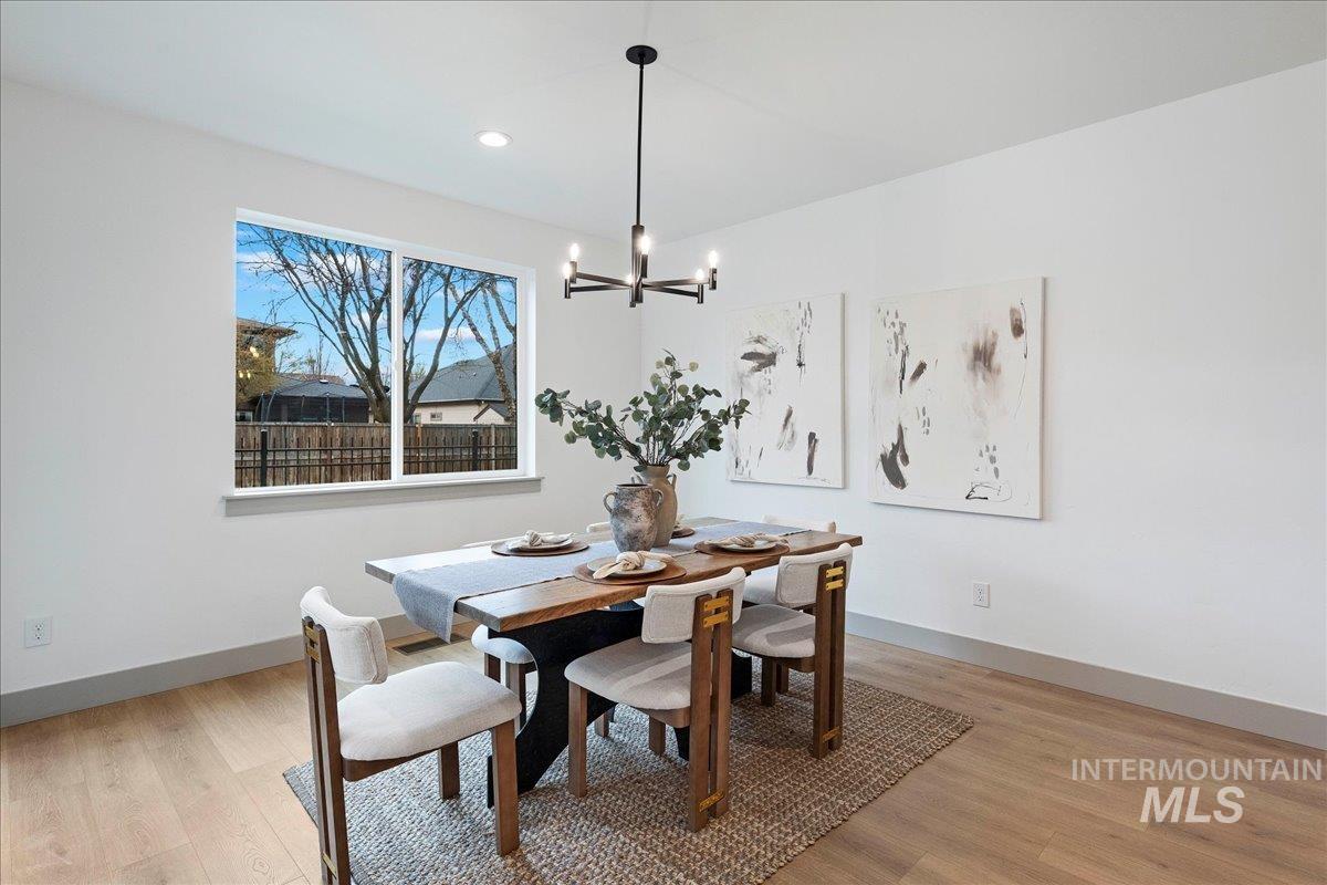 967 West Malbar Street Meridian, ID 83646 - Photo 11 of 33 Dining room with light wood finished floors and hanging lights