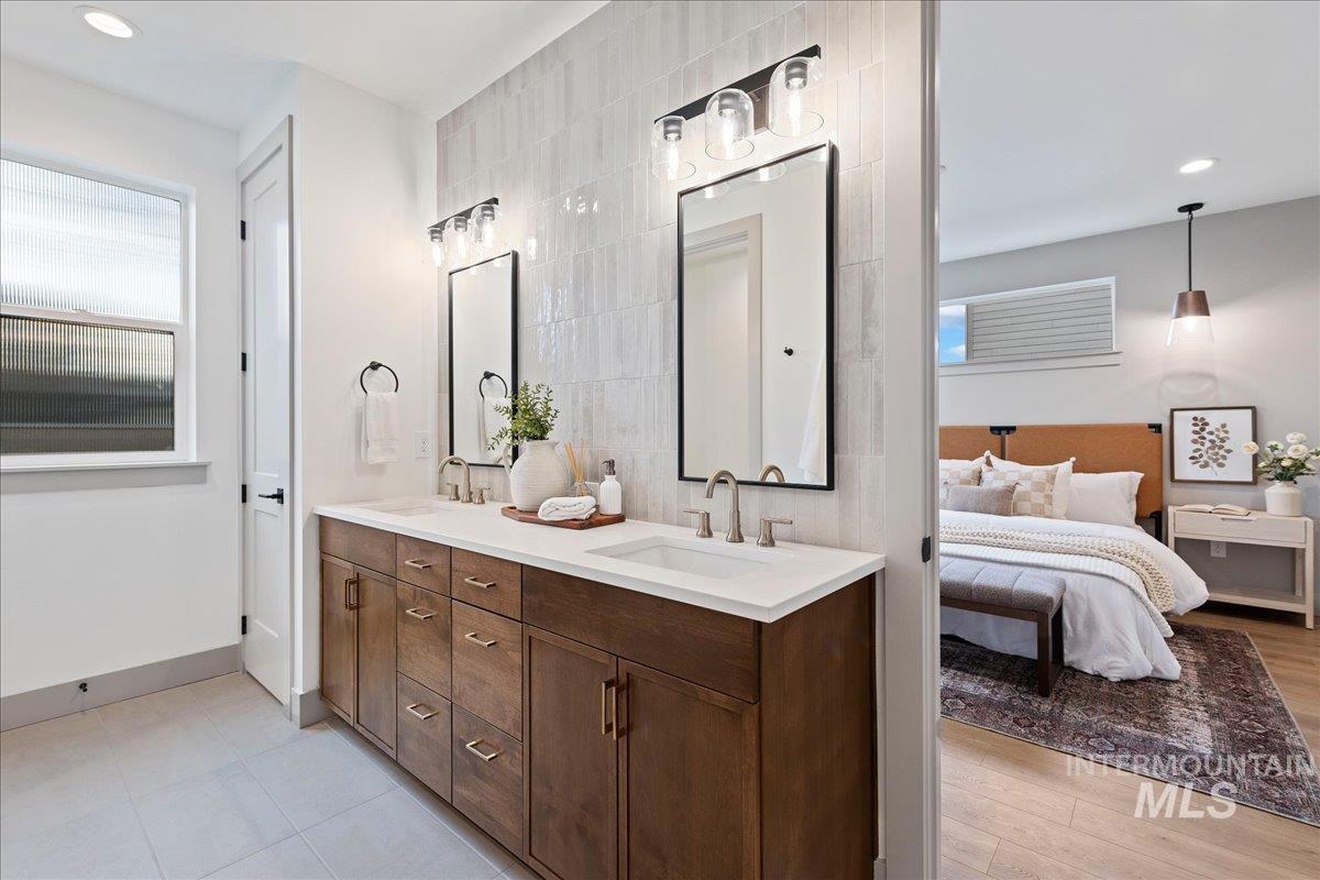 967 West Malbar Street Meridian, ID 83646 - Photo 16 of 33 Bathroom with recessed lighting, double vanity, ensuite bath, and tile walls