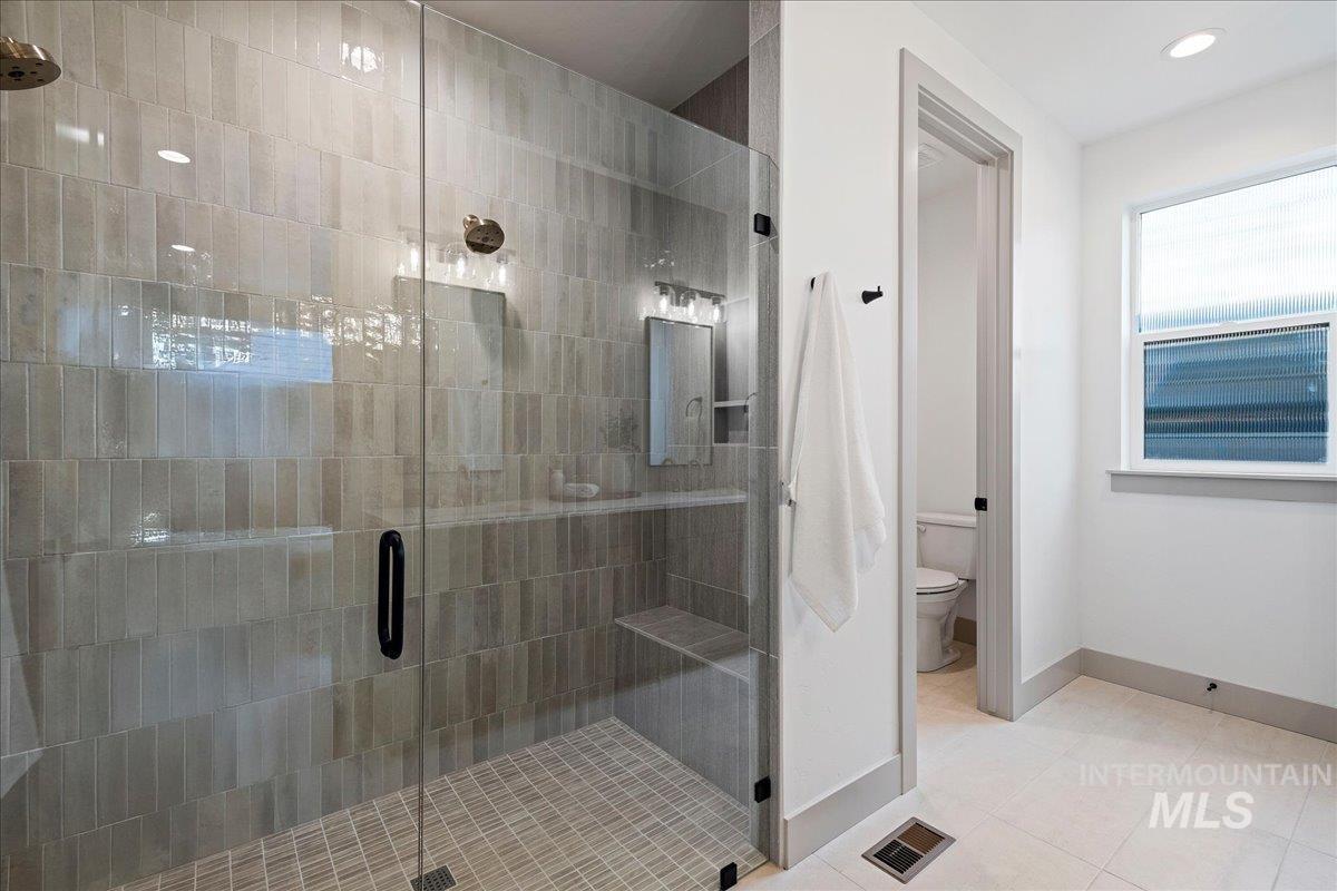 967 West Malbar Street Meridian, ID 83646 - Photo 19 of 33 Full bathroom with a shower stall, light tile patterned flooring, and recessed lighting