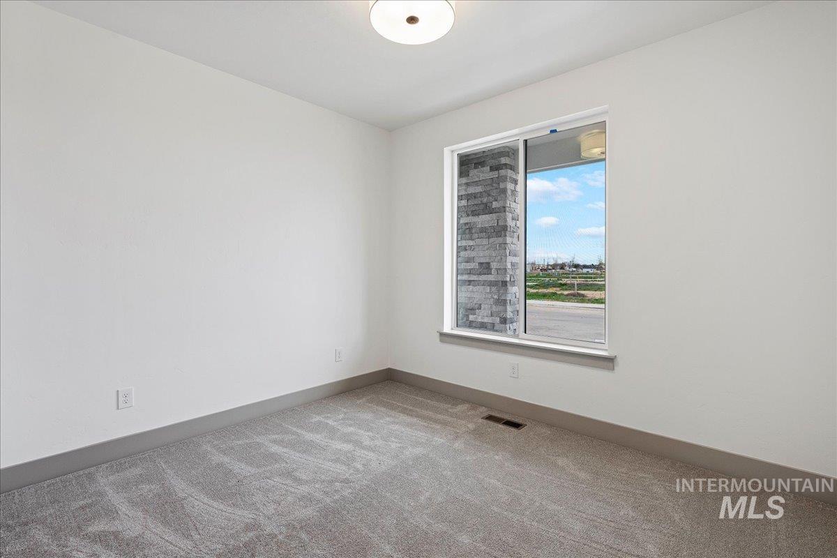 967 West Malbar Street Meridian, ID 83646 - Photo 20 of 33 Spare room with light colored carpet and baseboards