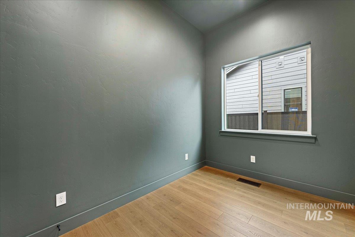 967 West Malbar Street Meridian, ID 83646 - Photo 24 of 33 Empty room featuring light wood-style flooring and baseboards