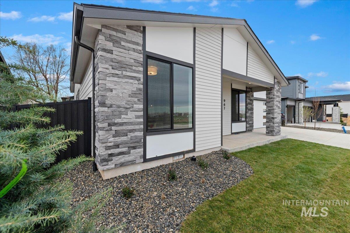 967 West Malbar Street Meridian, ID 83646 - Photo 29 of 33 Rear view of house featuring stone siding