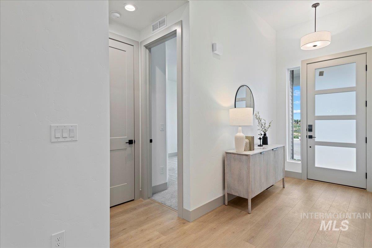 967 West Malbar Street Meridian, ID 83646 - Photo 4 of 33 Entryway with light wood-type flooring and baseboards