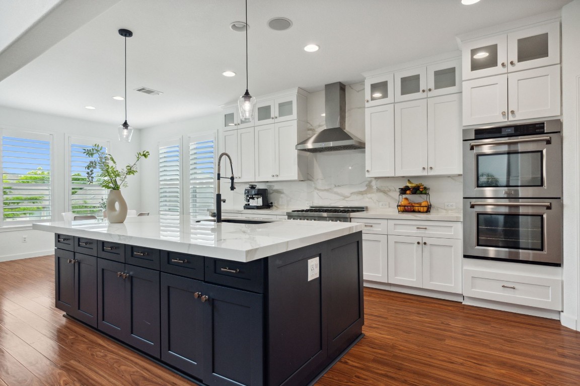 Stunning gourmet kitchen with thick durable porcelain counters and backsplash, Zline SS appliances, and expansive center island with storage on both sides.