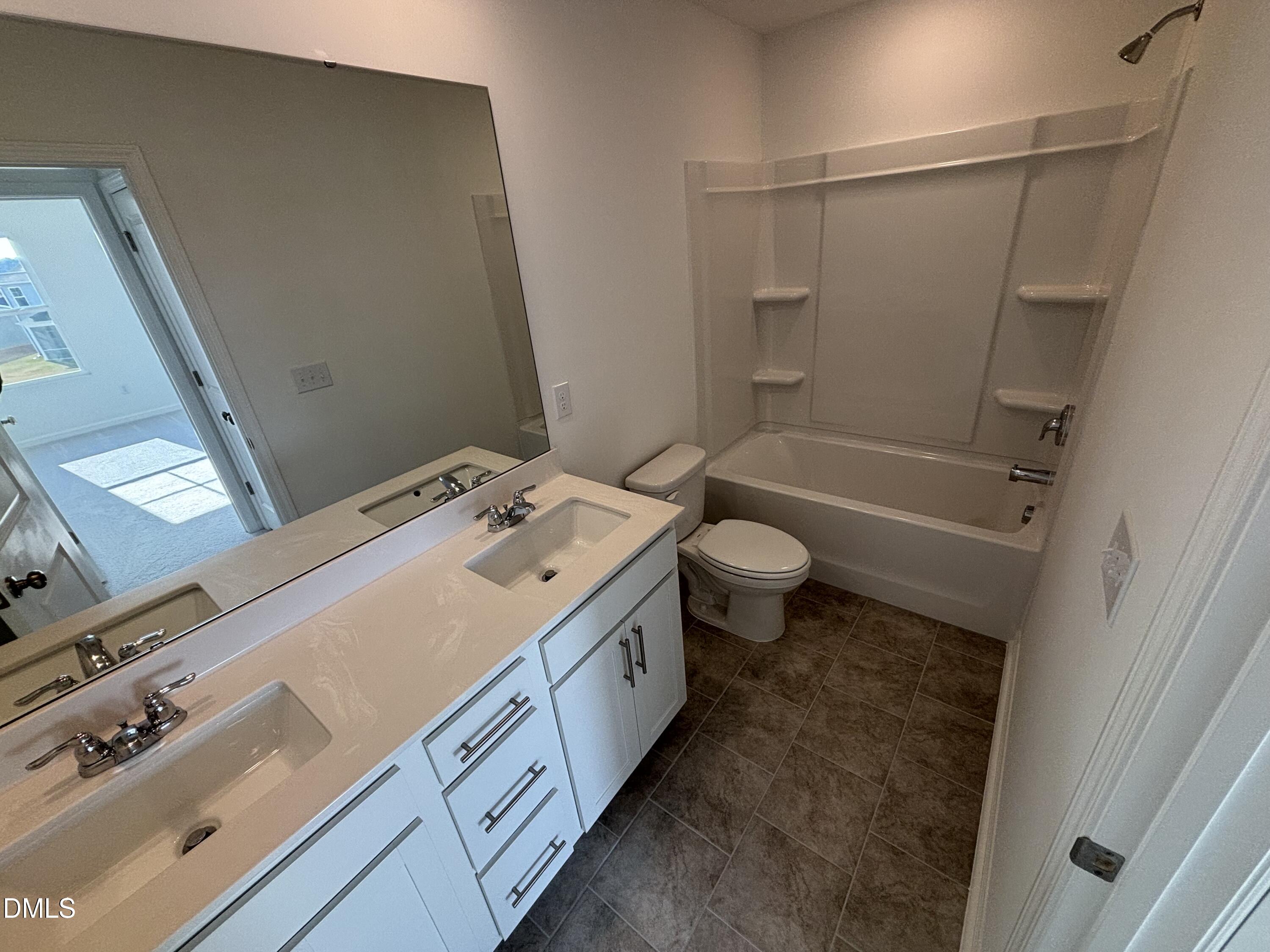 142 Blossom Fld Way Angier, NC 27501 - Photo 15 of 45 a bathroom with a granite countertop sink toilet and shower