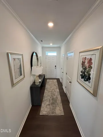 a living room with furniture and a painting