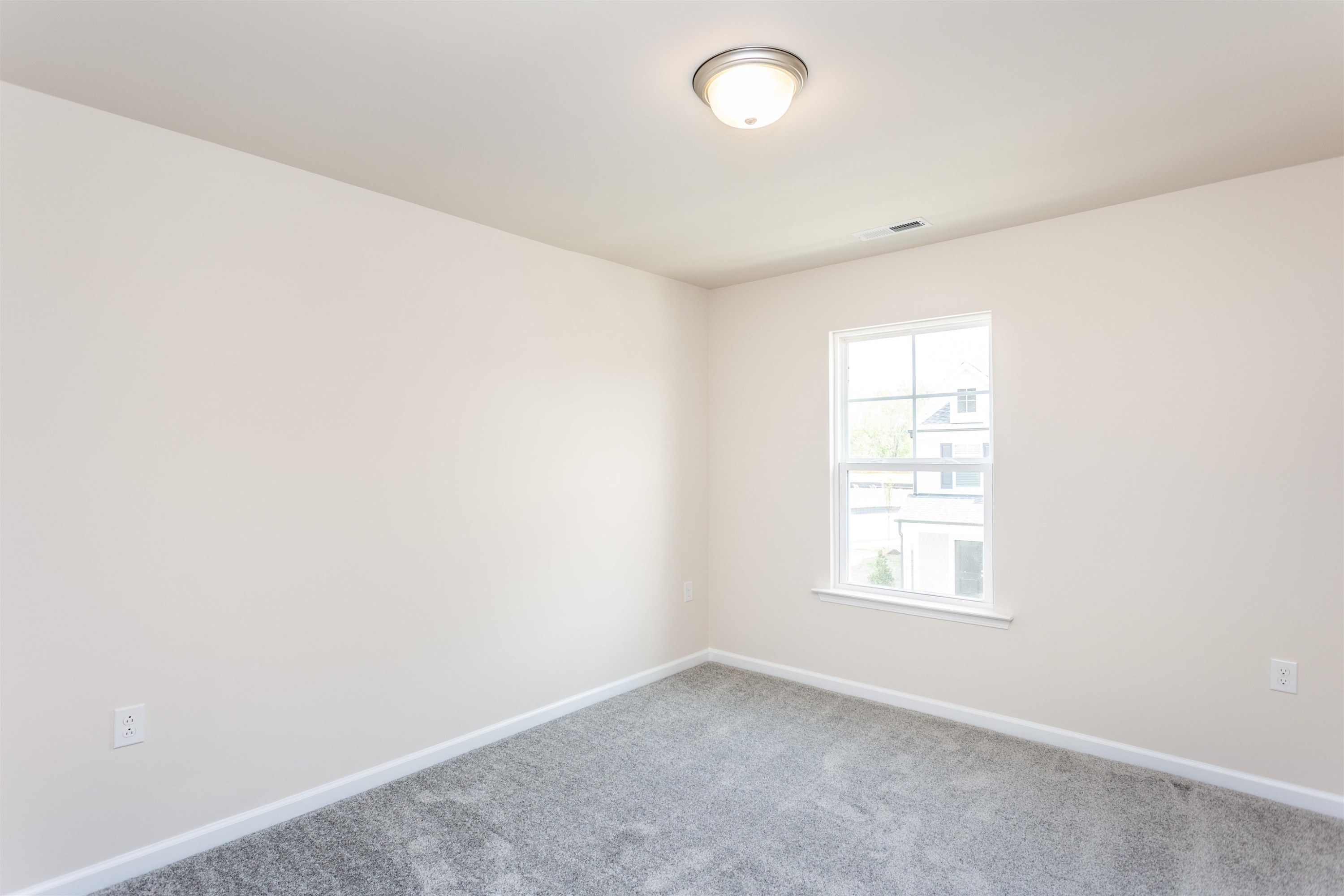 5602 Preveza Place Raleigh, NC 27603 - Photo 17 of 21 an empty room with windows