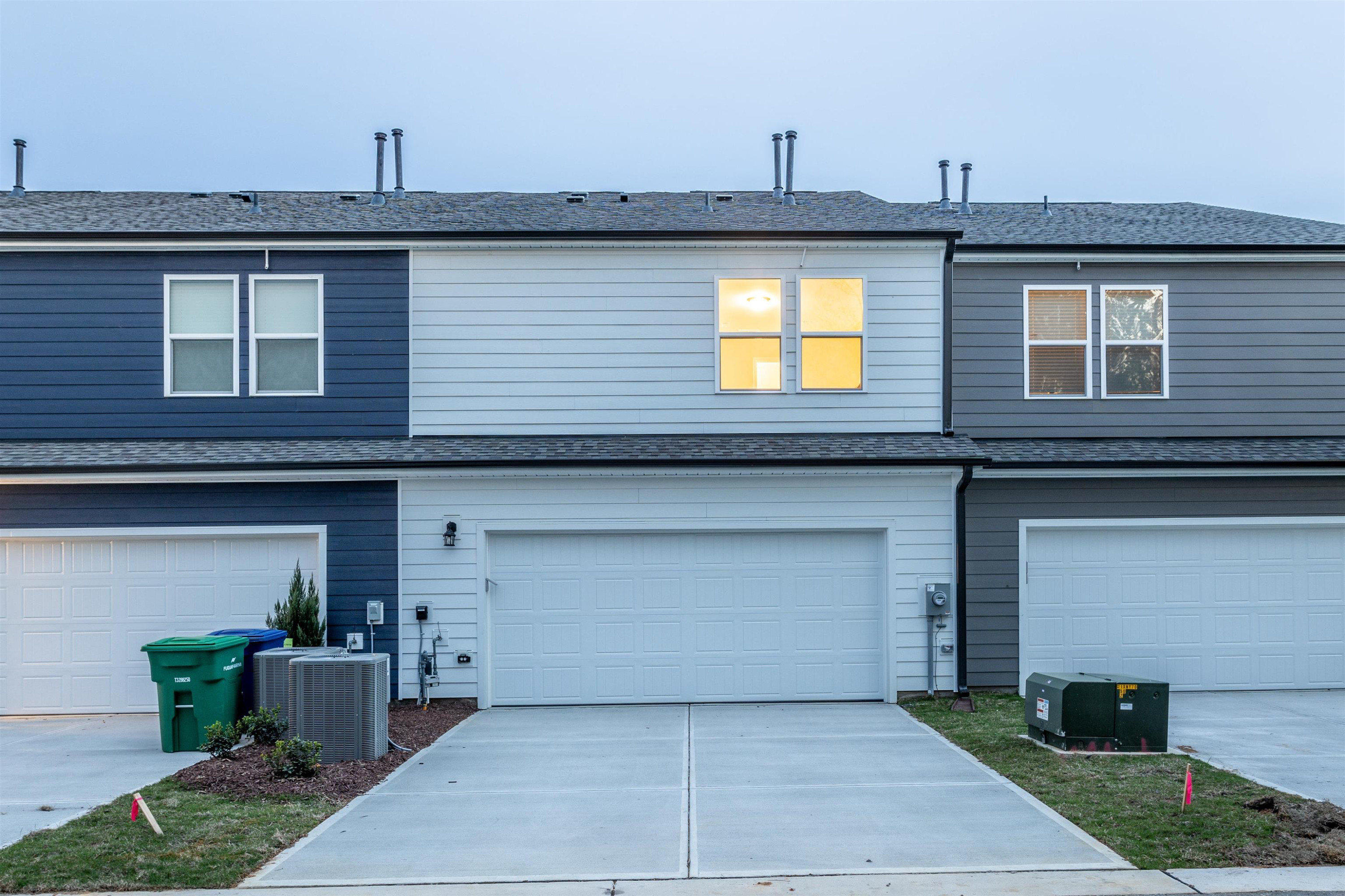 5602 Preveza Place Raleigh, NC 27603 - Photo 21 of 21 a front view of a house with garden