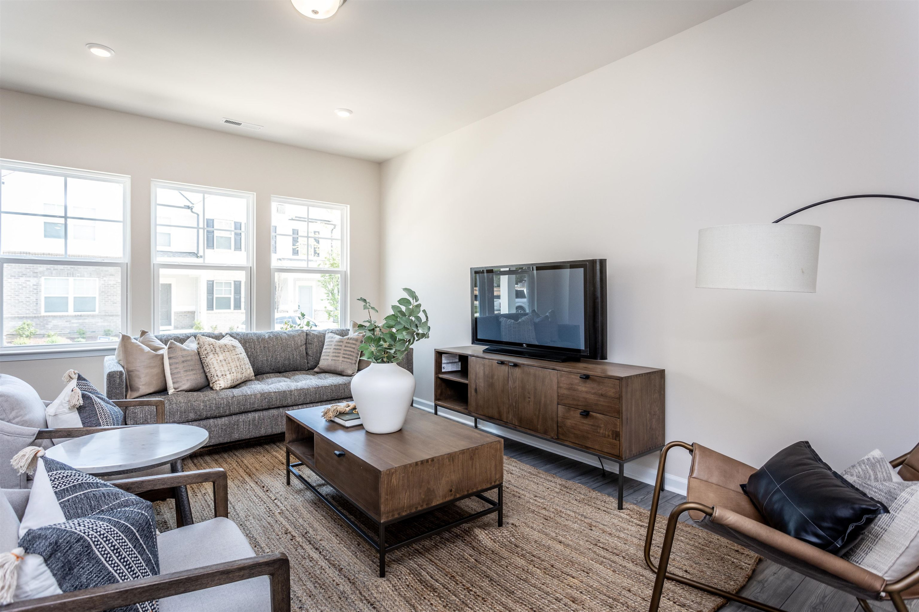 5602 Preveza Place Raleigh, NC 27603 - Photo 3 of 21 a living room with furniture and a flat screen tv