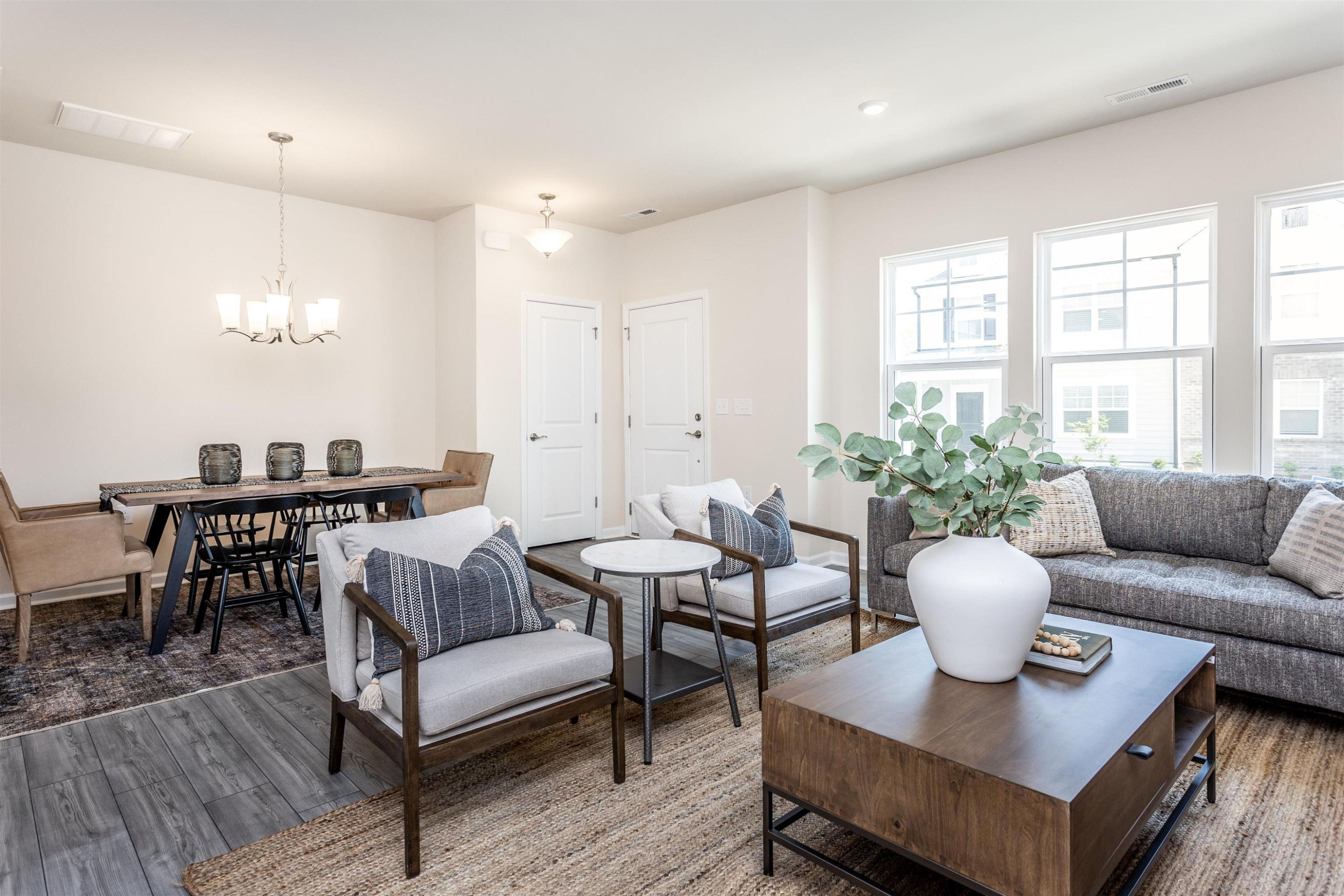 5602 Preveza Place Raleigh, NC 27603 - Photo 4 of 21 a living room with furniture and a large window
