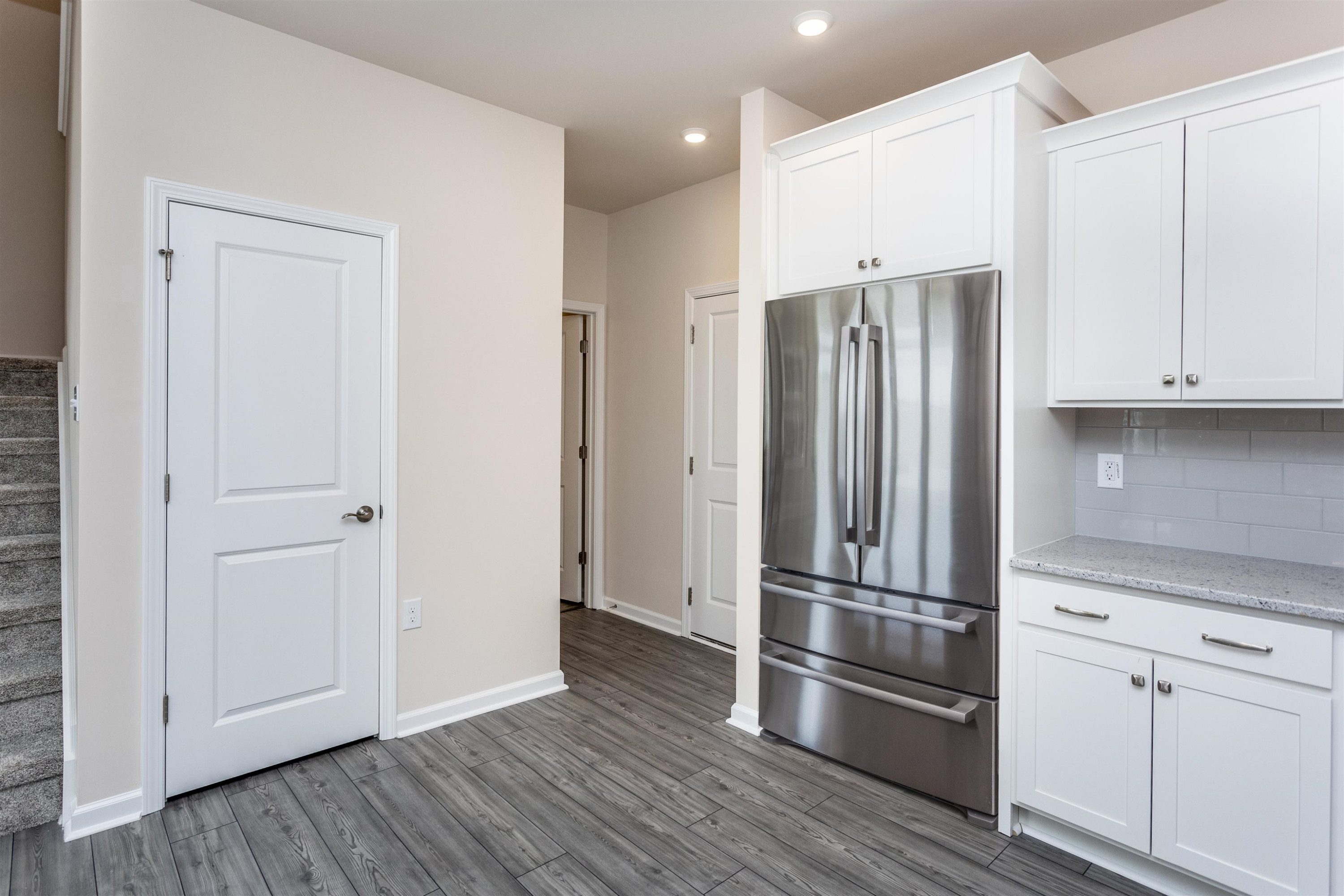 5602 Preveza Place Raleigh, NC 27603 - Photo 9 of 21 a metallic refrigerator freezer sitting in a kitchen