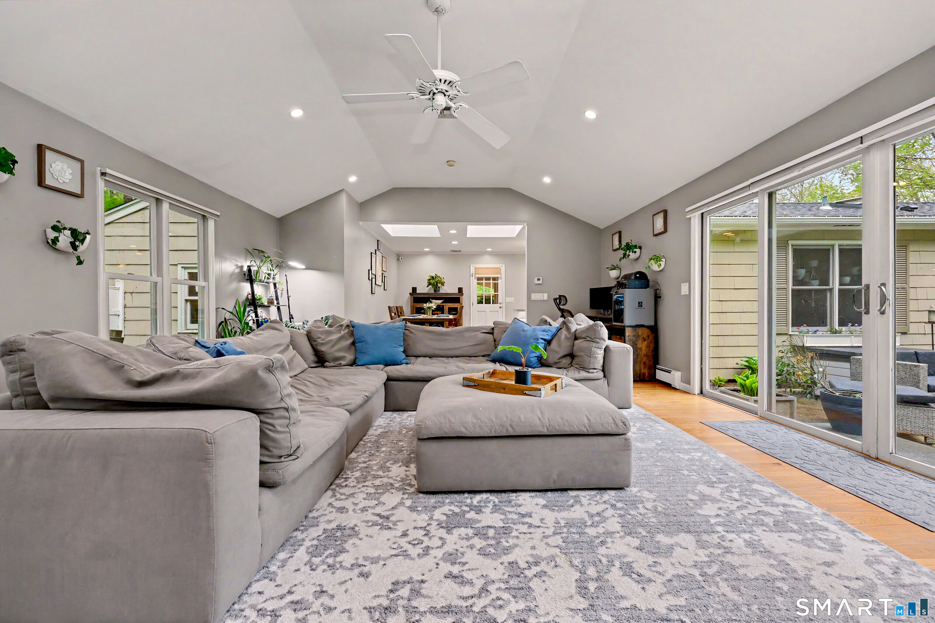 46 Todds Road Ridgefield, CT 06877 - Photo 12 of 35 Oversized family room with vaulted ceilings, wood burning stove and sliders to the flagstone patio.
