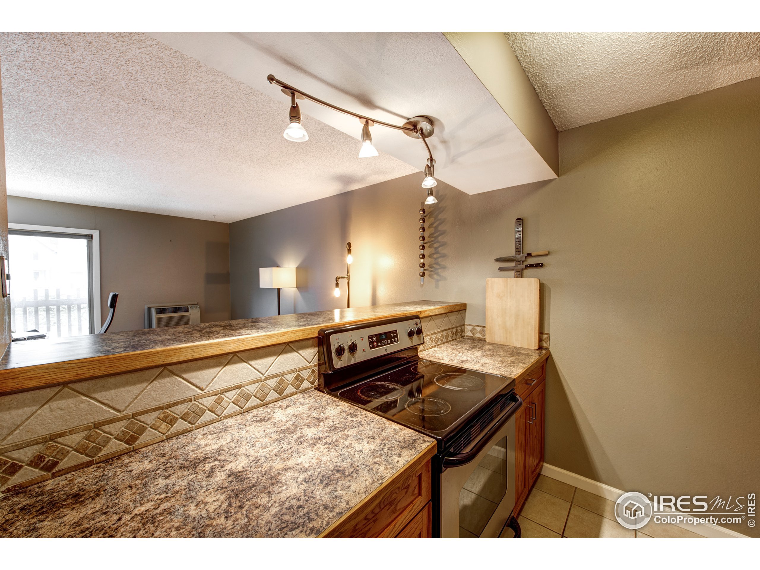 2707 Valmont Road, Unit B207 Boulder, CO 80304 - Photo 9 of 29 a kitchen with a stove and a sink