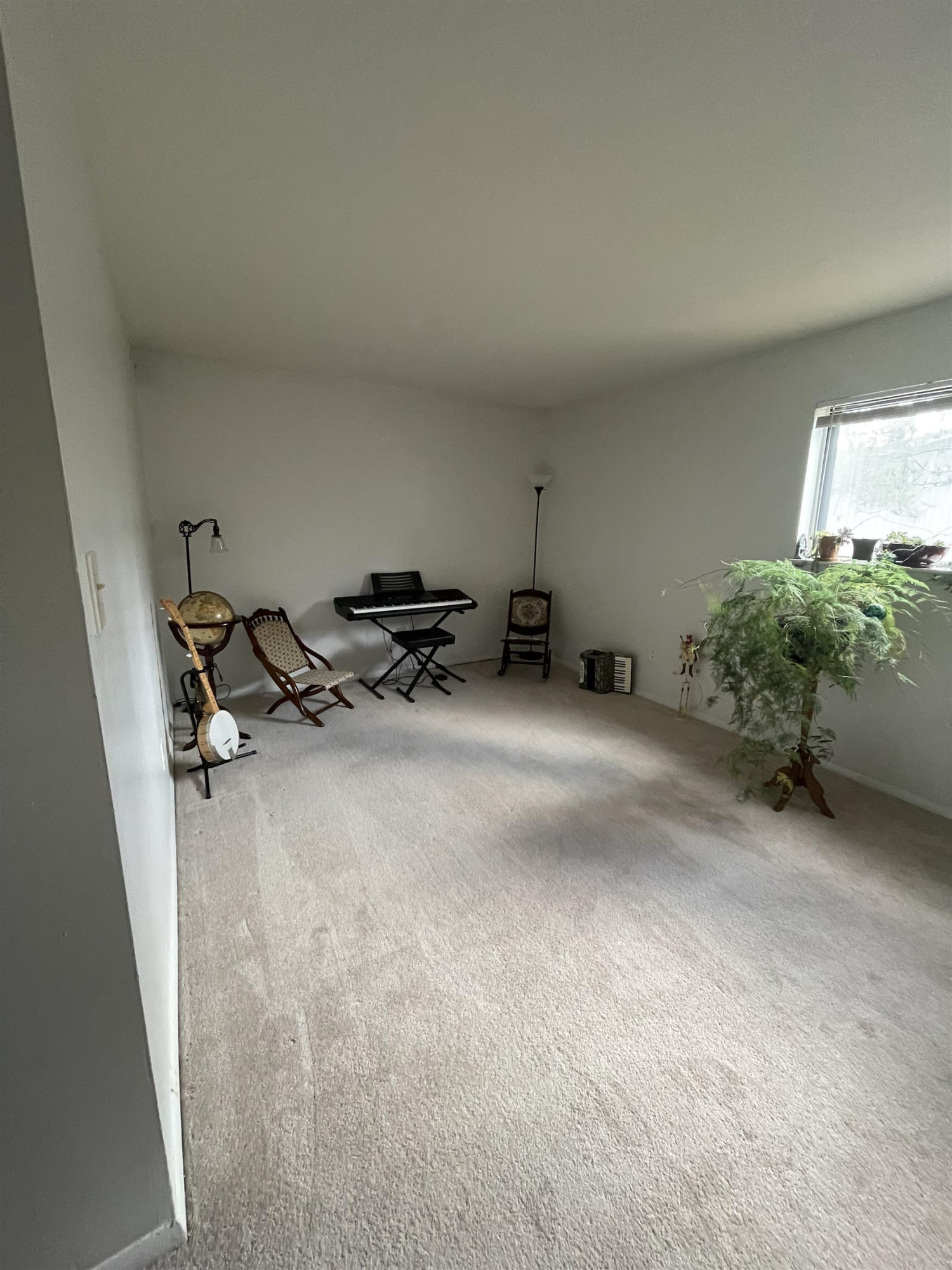 1010 Sandlin Place, Unit H Raleigh, NC 27606 - Photo 11 of 15 a view of a room with furniture and a window