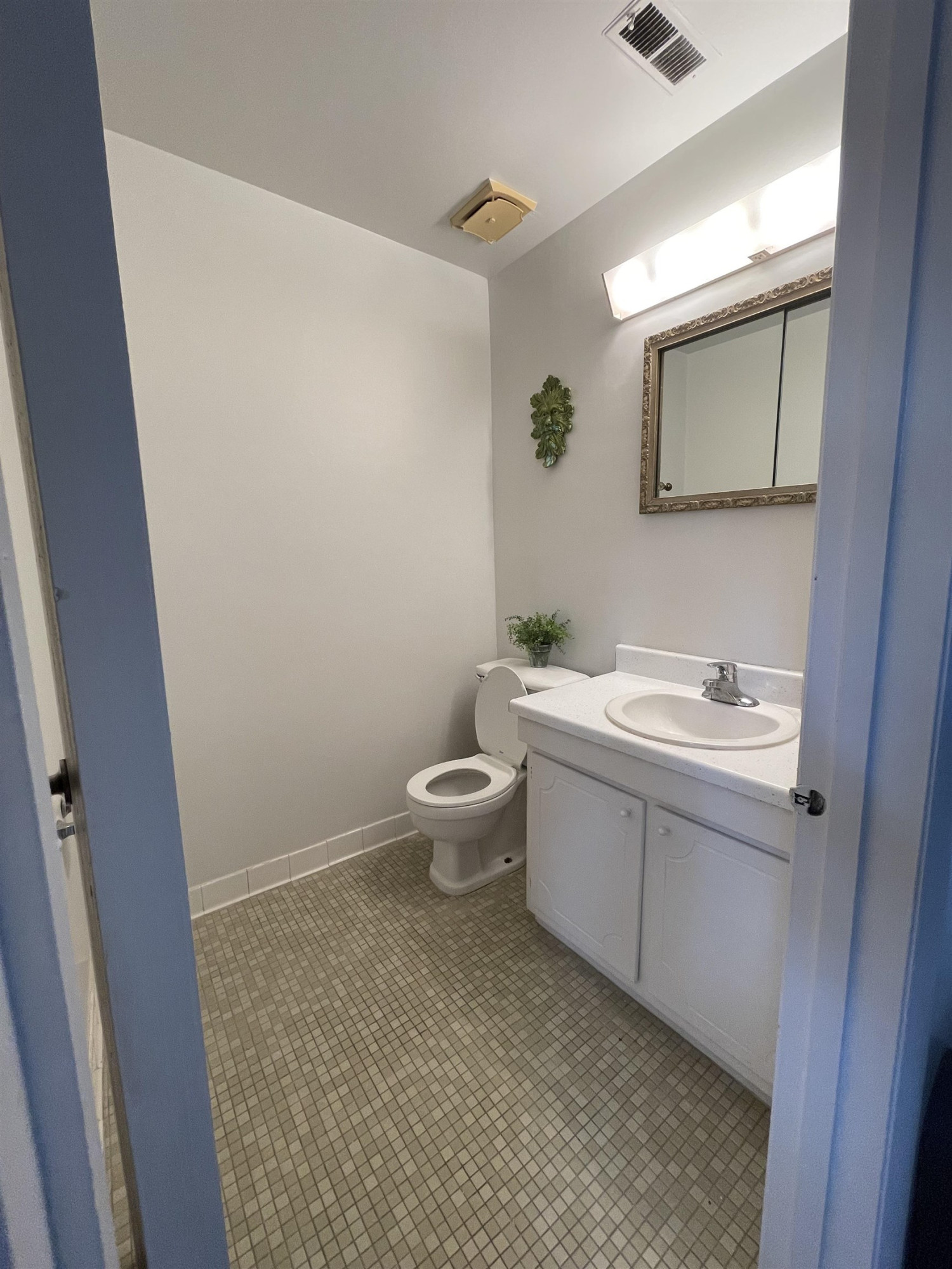 1010 Sandlin Place, Unit H Raleigh, NC 27606 - Photo 12 of 15 a bathroom with a sink and a mirror