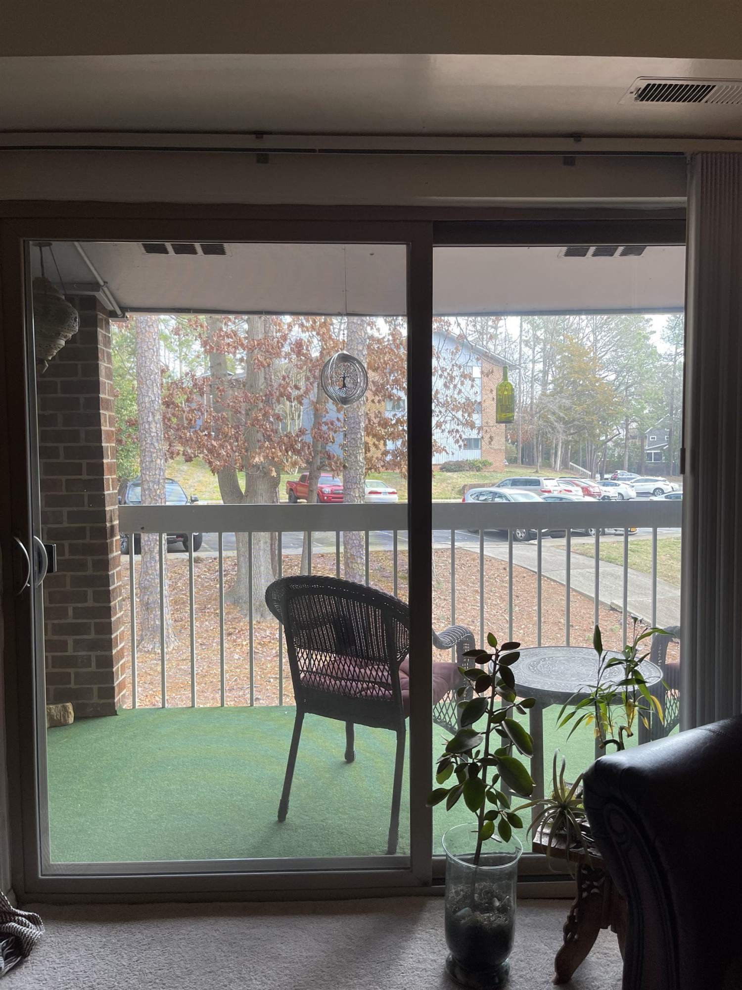 1010 Sandlin Place, Unit H Raleigh, NC 27606 - Photo 14 of 15 a living room filled with furniture and a potted plant