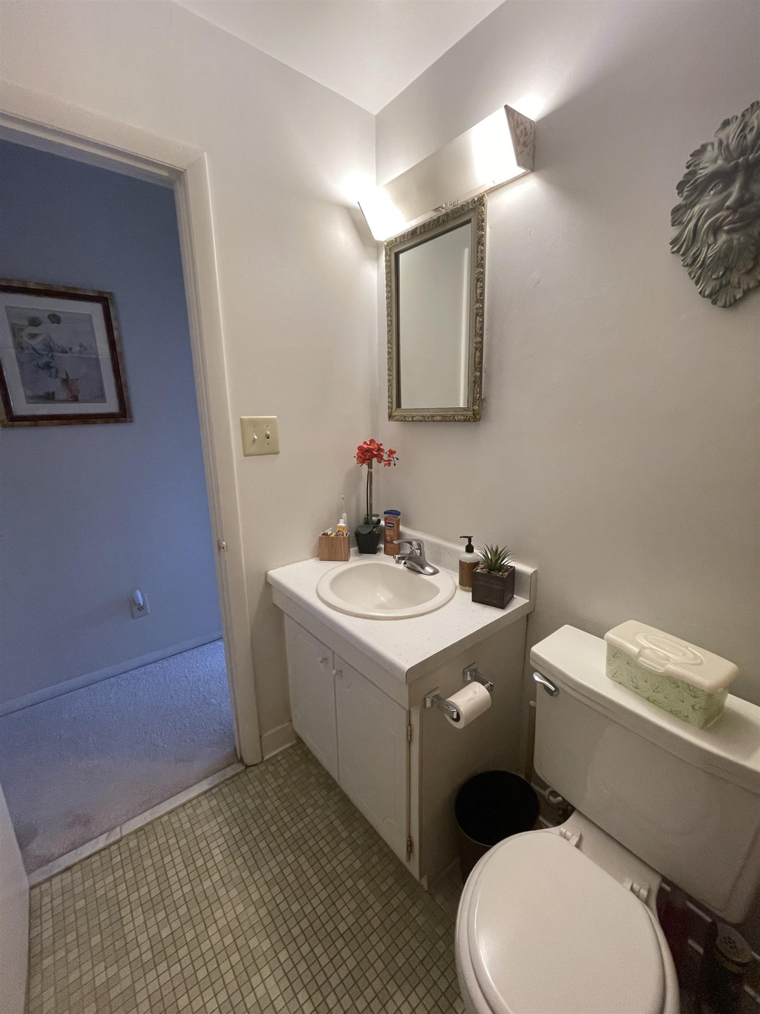 1010 Sandlin Place, Unit H Raleigh, NC 27606 - Photo 10 of 15 a white toilet sitting next to a bathroom sink