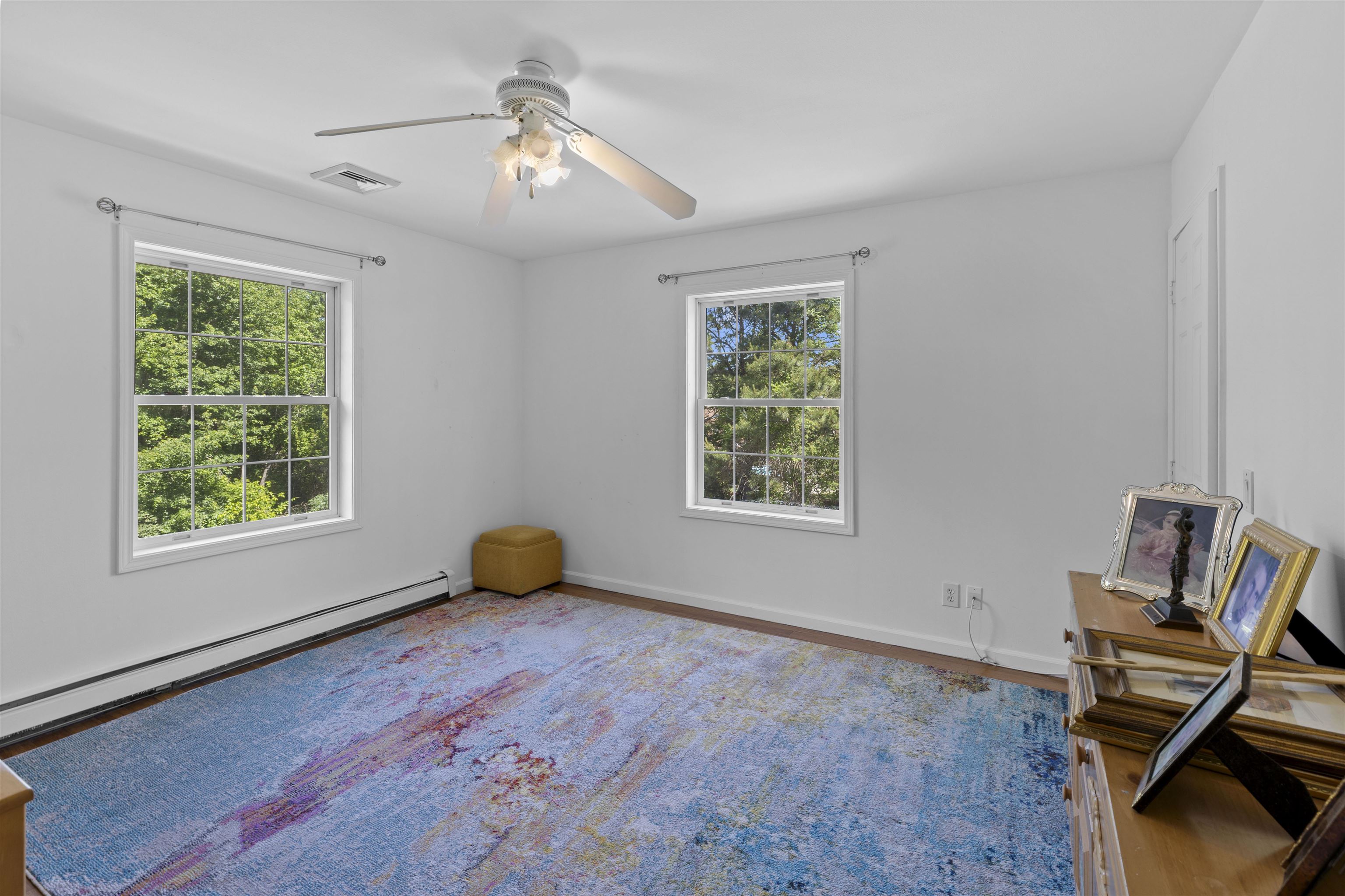551 Shunpike Road Cape May Court House, NJ 08210 - Photo 27 of 47 a room with gym equipment on wooden floor and window