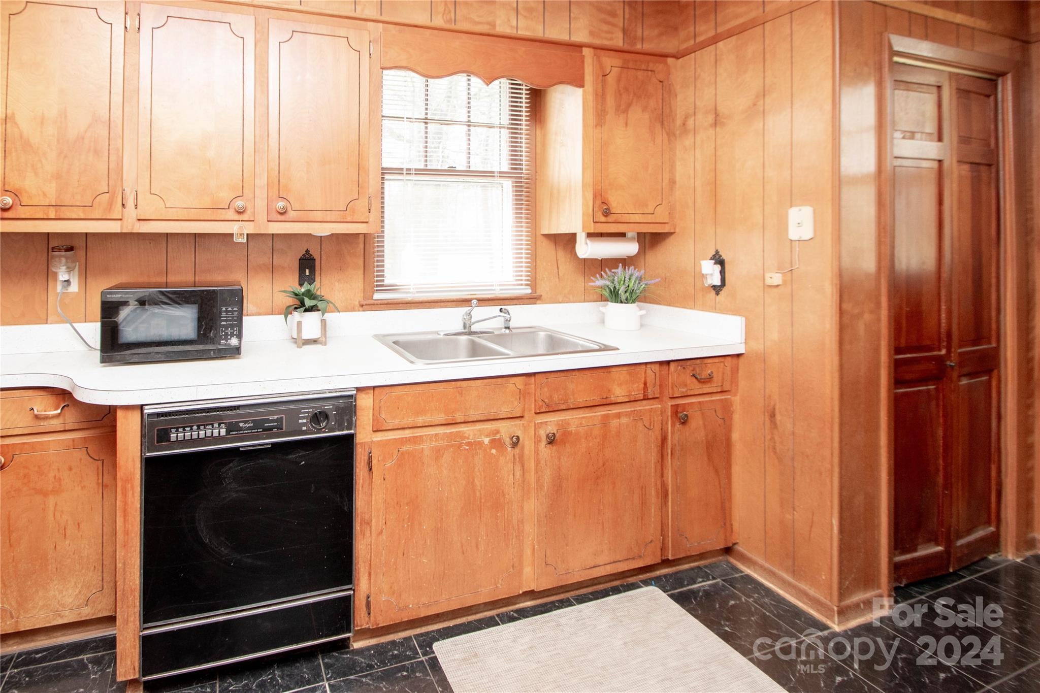 1516 Pleasant Plains Road Matthews, NC 28105 - Photo 11 of 29 a kitchen with a sink stove and cabinets