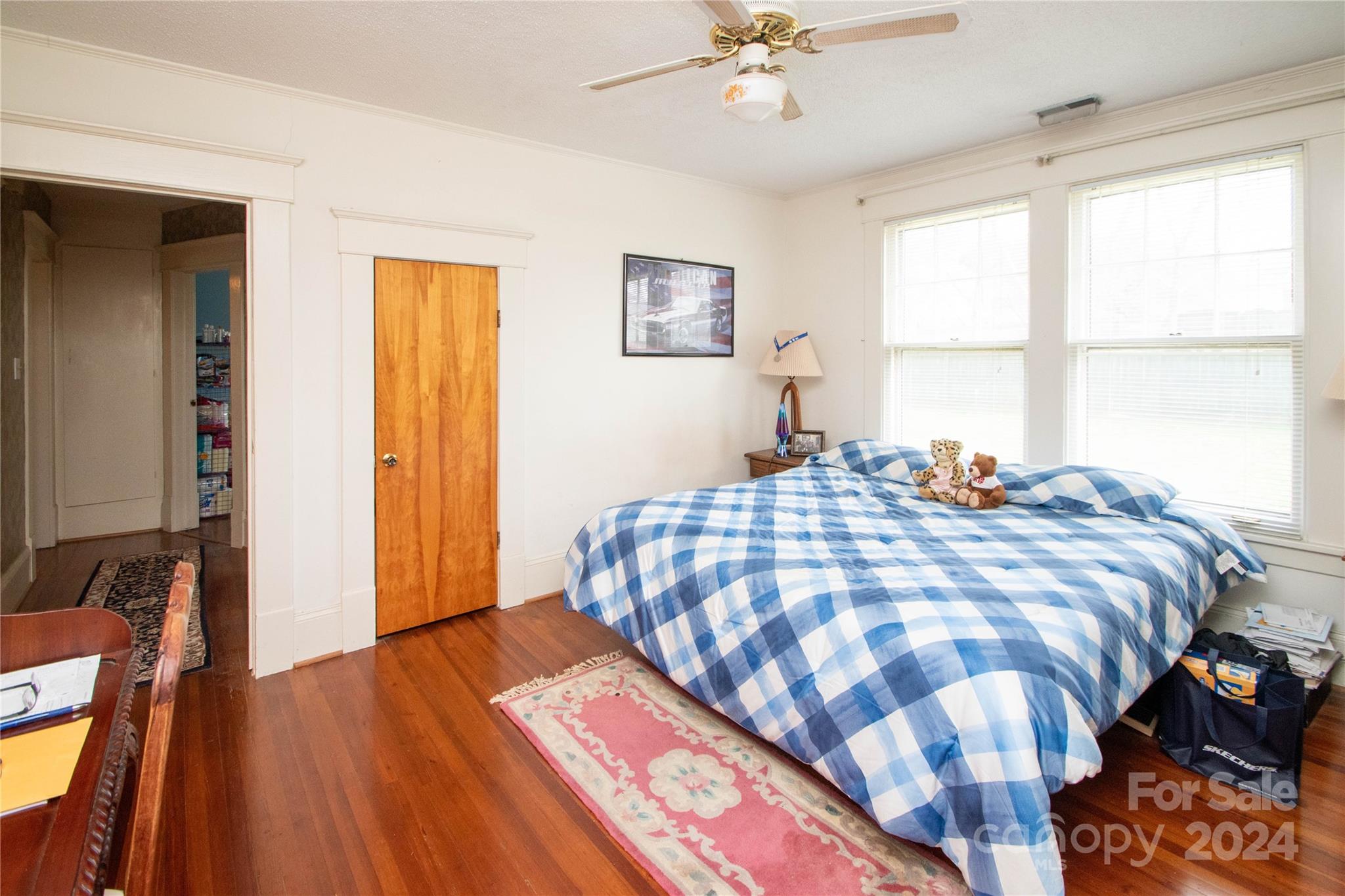 1516 Pleasant Plains Road Matthews, NC 28105 - Photo 16 of 29 a bedroom with a bed and wooden floor