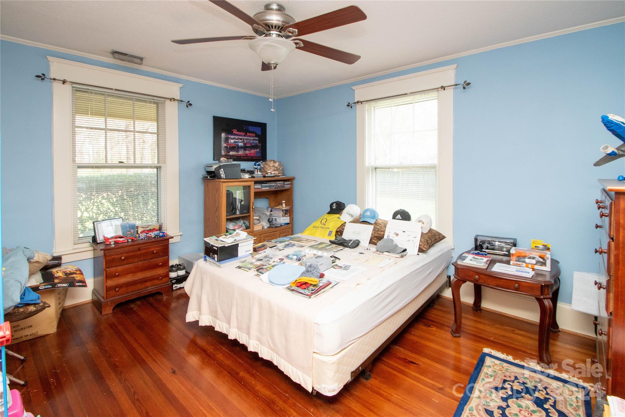 1516 Pleasant Plains Road Matthews, NC 28105 - Photo 19 of 29 a bed sitting in a bedroom next to a window