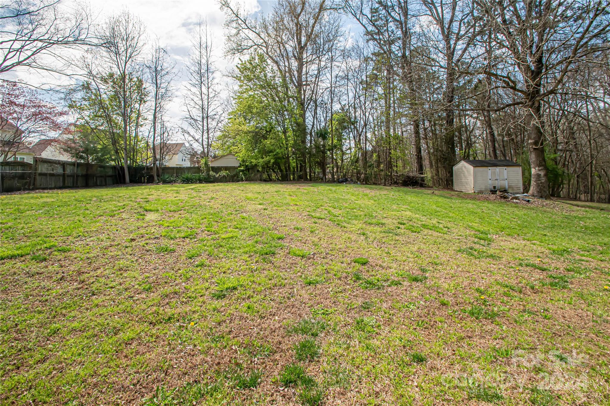 1516 Pleasant Plains Road Matthews, NC 28105 - Photo 29 of 29 a yard with a trees