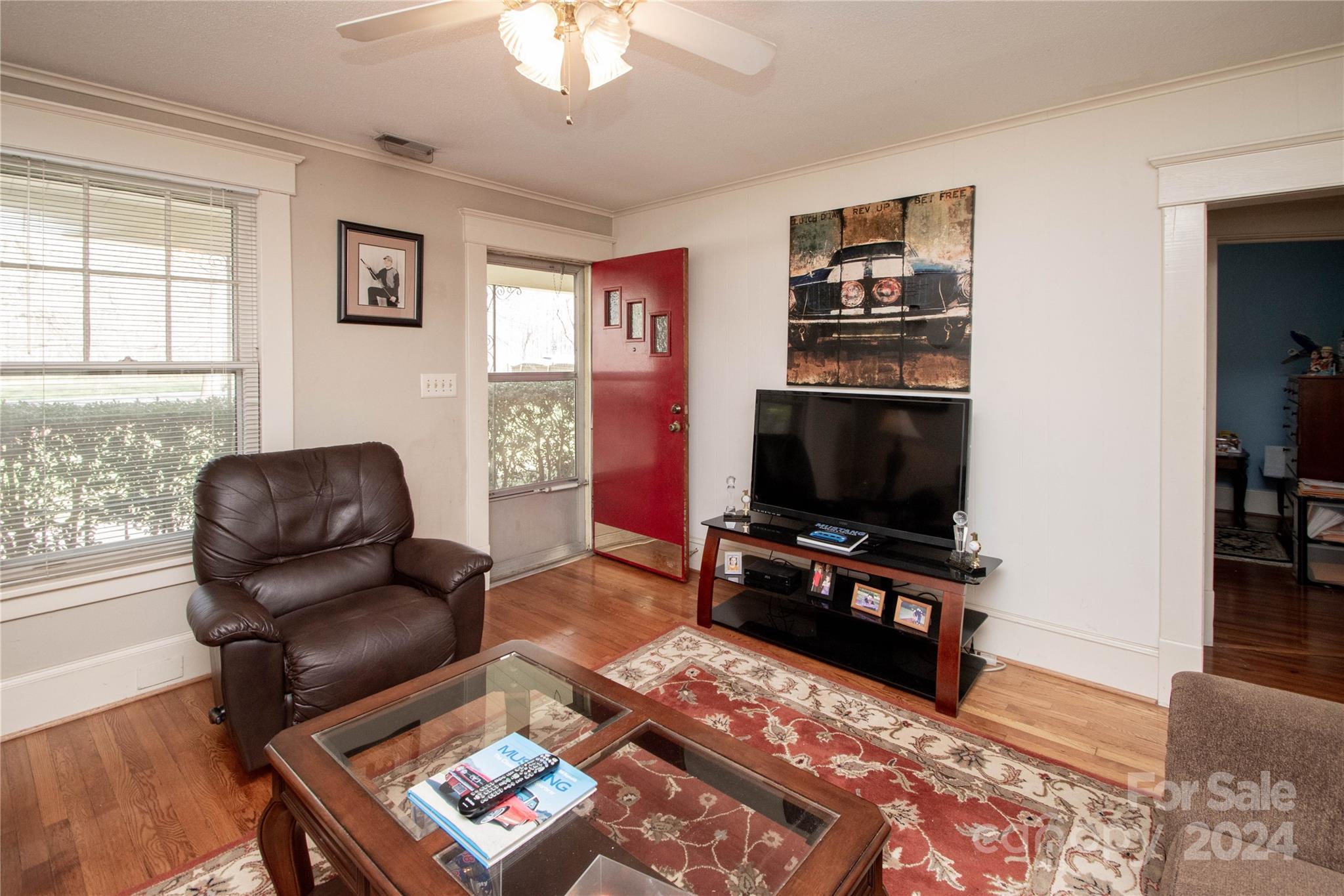 1516 Pleasant Plains Road Matthews, NC 28105 - Photo 4 of 29 a living room with furniture and a flat screen tv