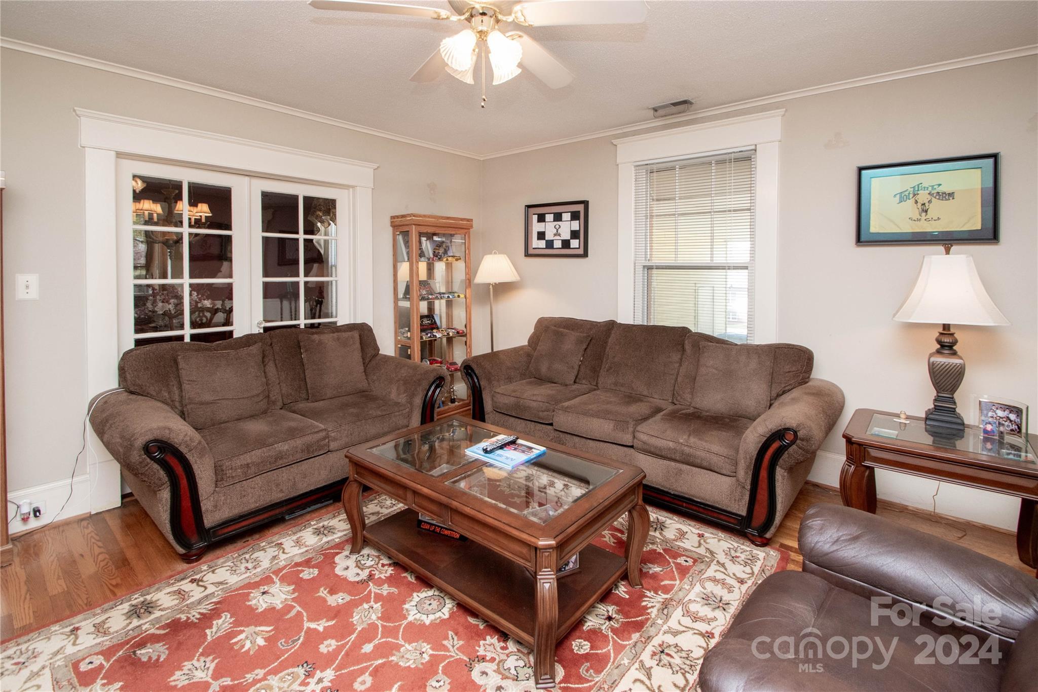 1516 Pleasant Plains Road Matthews, NC 28105 - Photo 5 of 29 a living room with furniture a lamp and a window