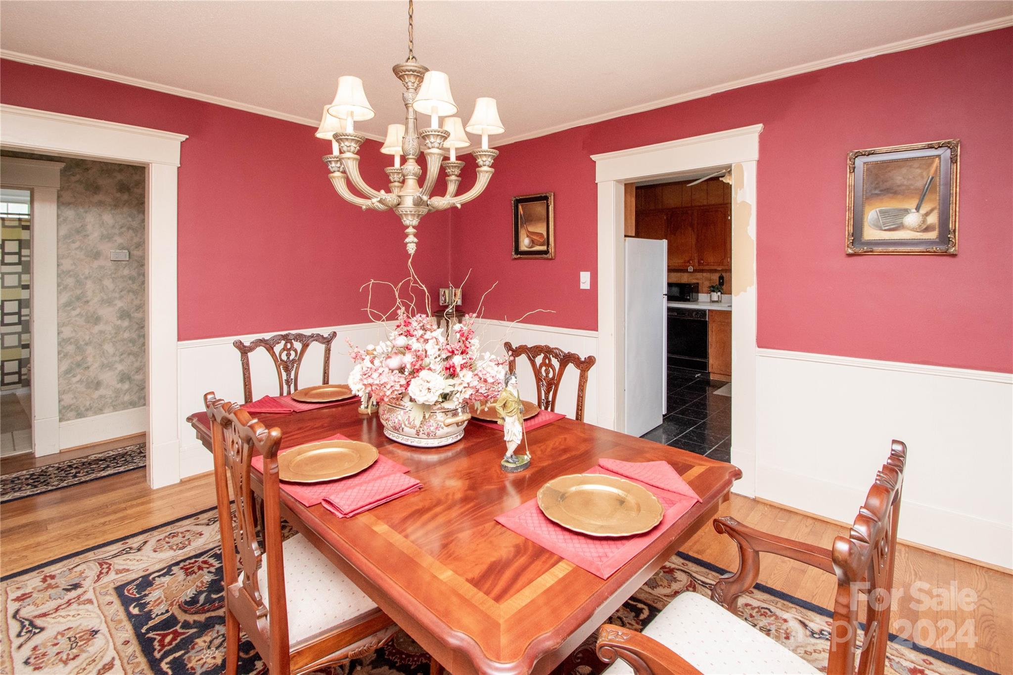 1516 Pleasant Plains Road Matthews, NC 28105 - Photo 8 of 29 a view of a dining room with furniture a chandelier and wooden floor