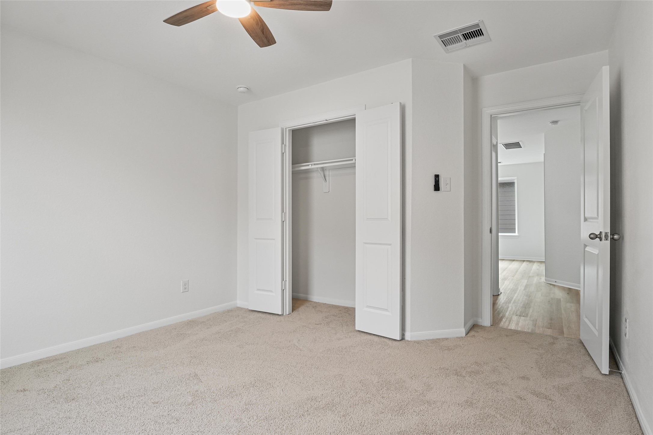 10511 Kings River Drive Rosharon, TX 77583 - Photo 18 of 25 an empty room with closet and windows