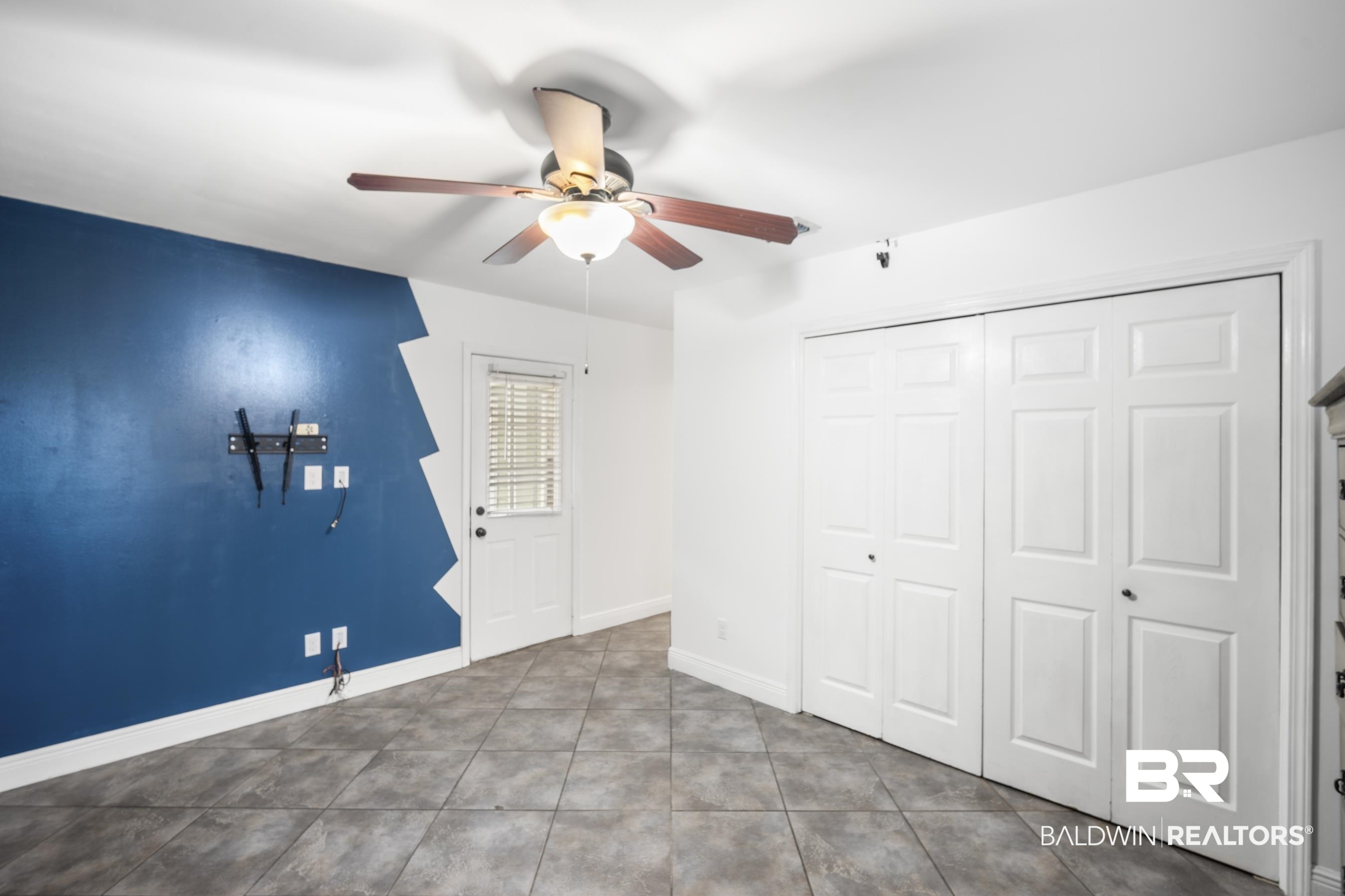 3101 Autumn Ridge Drive West Mobile, AL 36695 - Photo 24 of 36 Unfurnished bedroom featuring a ceiling fan, a closet, and tile patterned floors