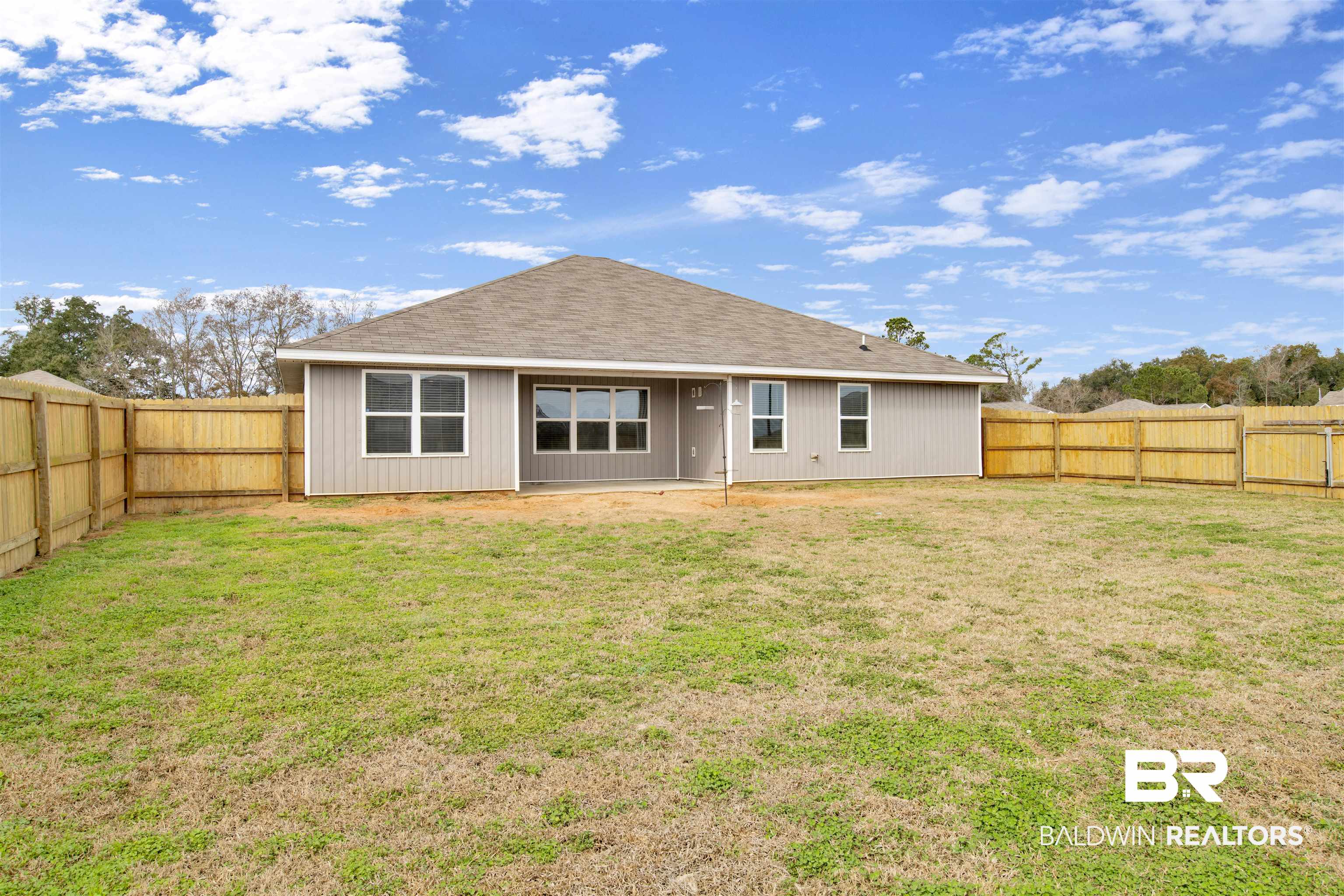 304 Hartenstein Road Foley, AL 36535 - Photo 26 of 28 Back of property featuring a lawn