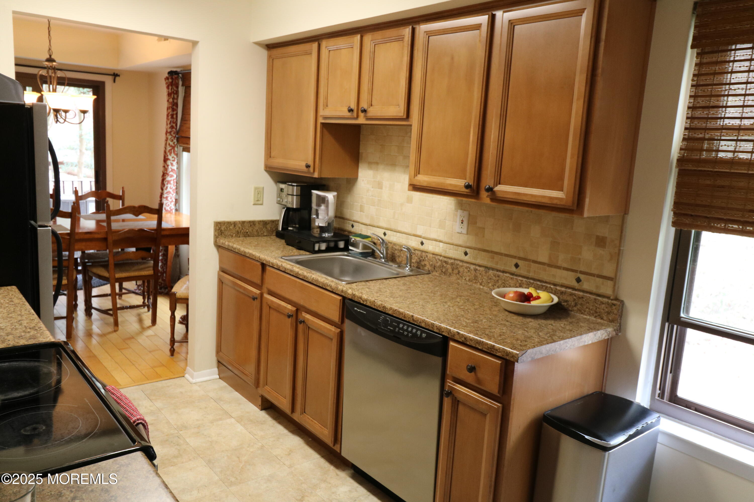 200 Portland Road, Unit E23 Highlands, NJ 07732 - Photo 11 of 33 a kitchen with sink cabinets and outdoor view
