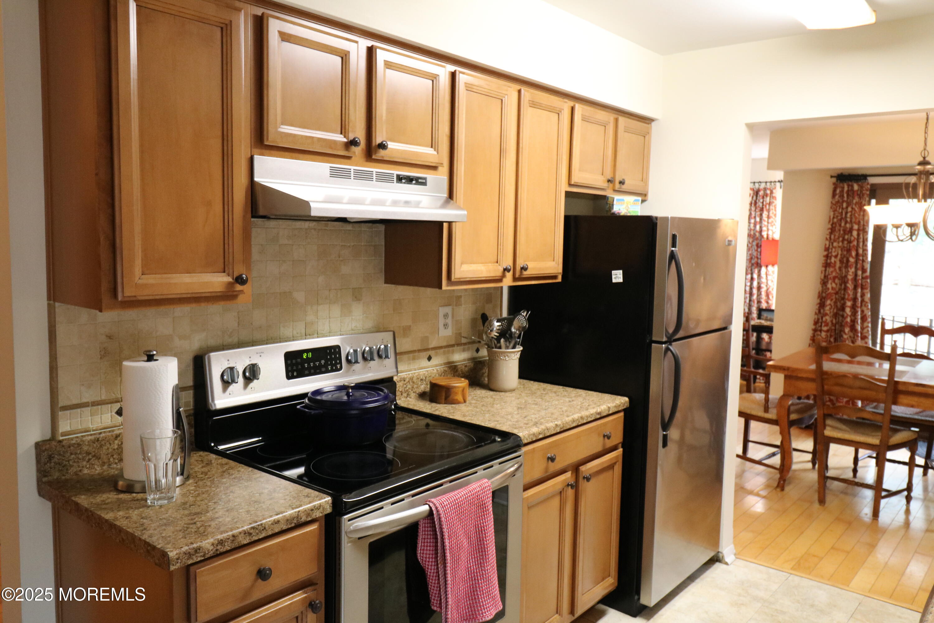 200 Portland Road, Unit E23 Highlands, NJ 07732 - Photo 12 of 33 a kitchen with granite countertop a refrigerator stove and sink