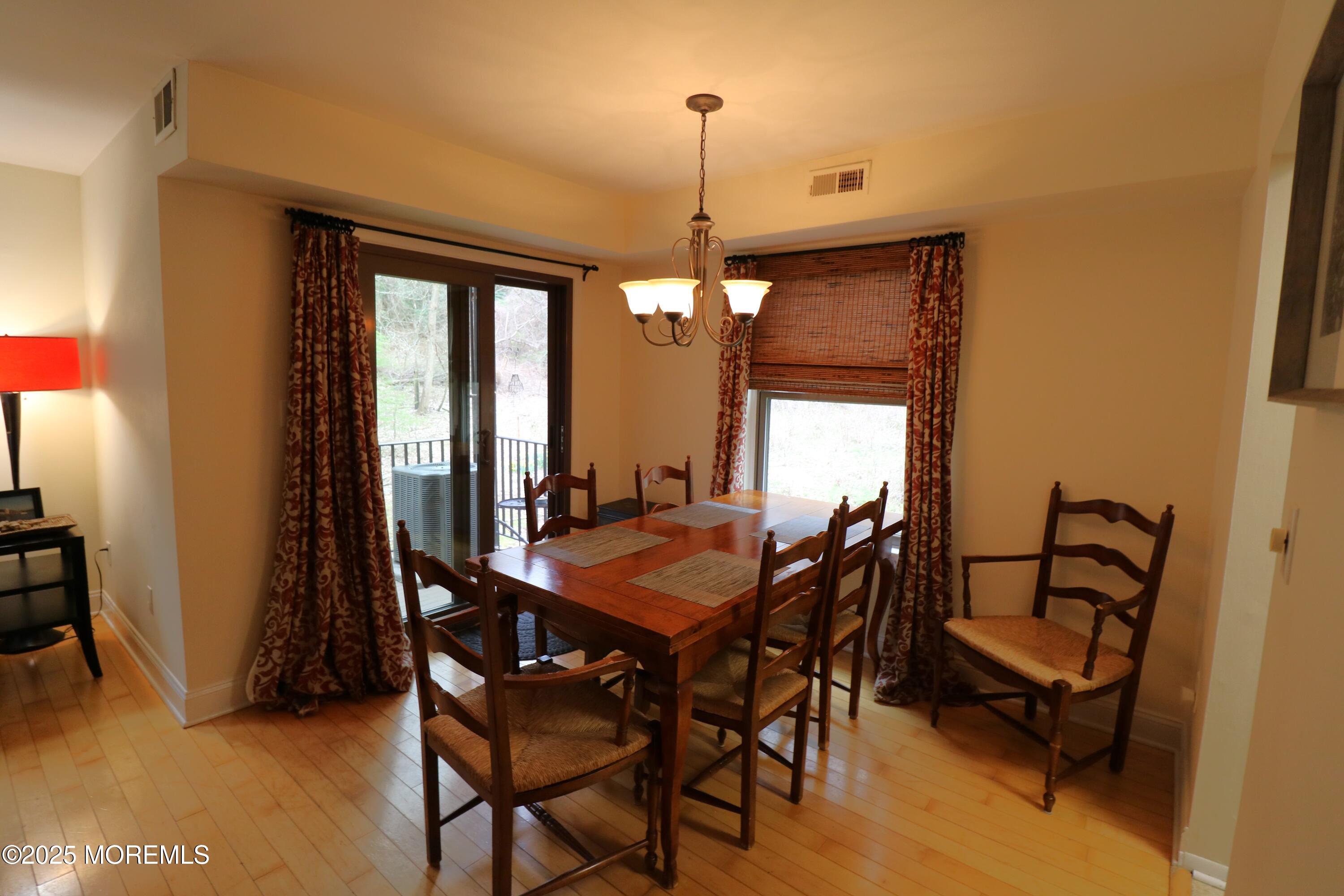 200 Portland Road, Unit E23 Highlands, NJ 07732 - Photo 8 of 33 a dining room with furniture and window