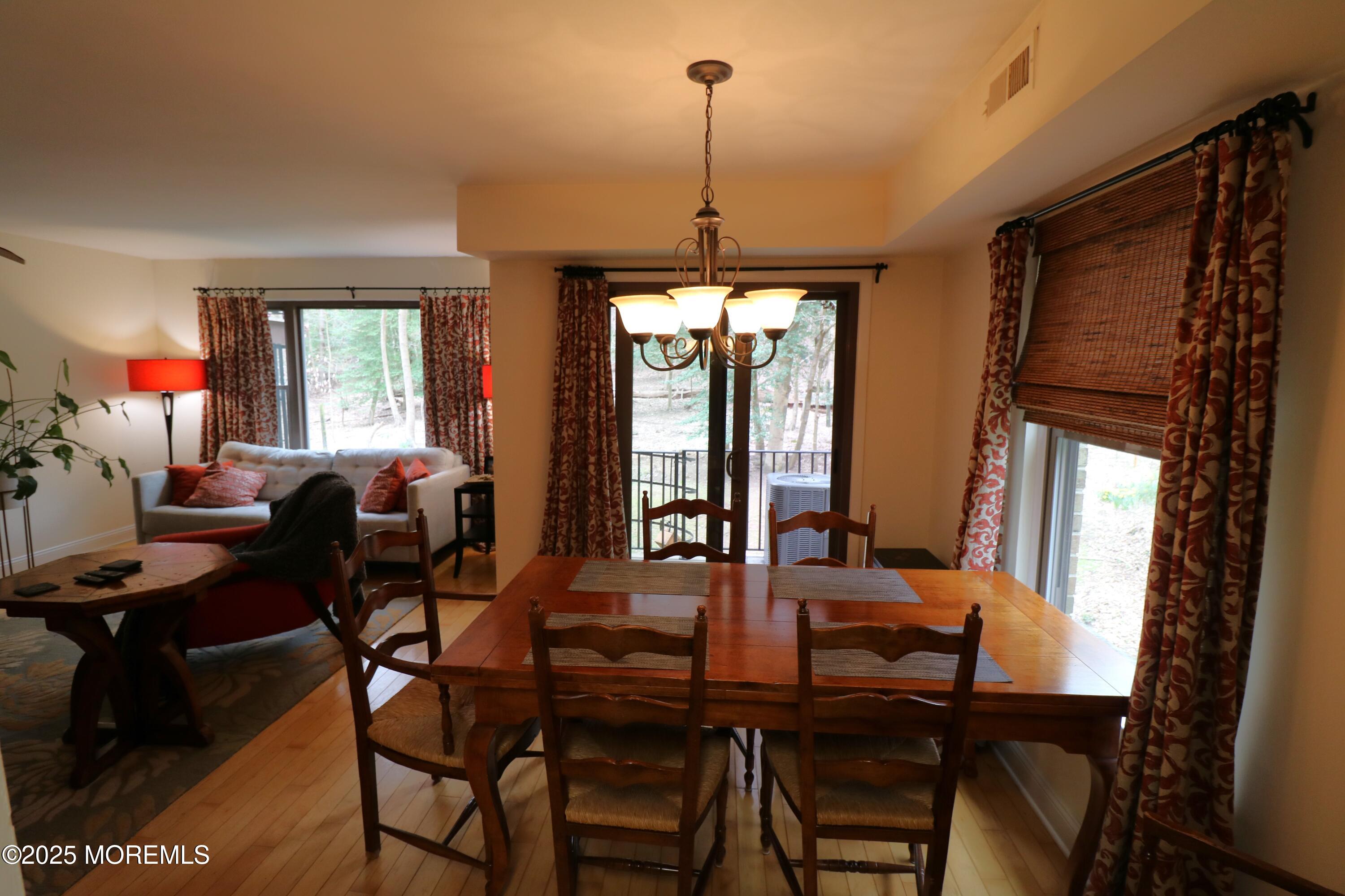 200 Portland Road, Unit E23 Highlands, NJ 07732 - Photo 9 of 33 a view of a dining room with furniture window and outside view