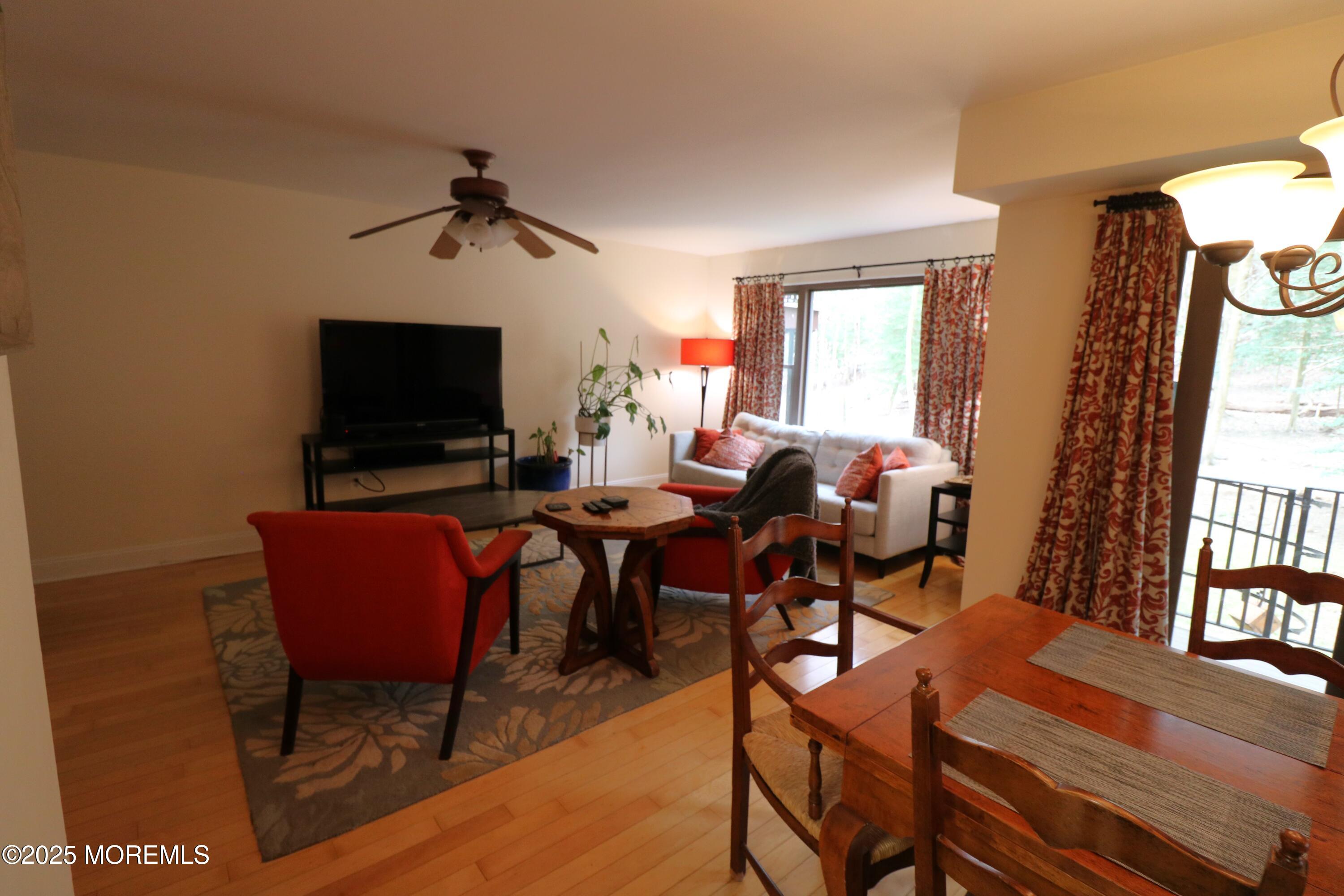 200 Portland Road, Unit E23 Highlands, NJ 07732 - Photo 10 of 33 a view of a dining room with furniture window and wooden floor