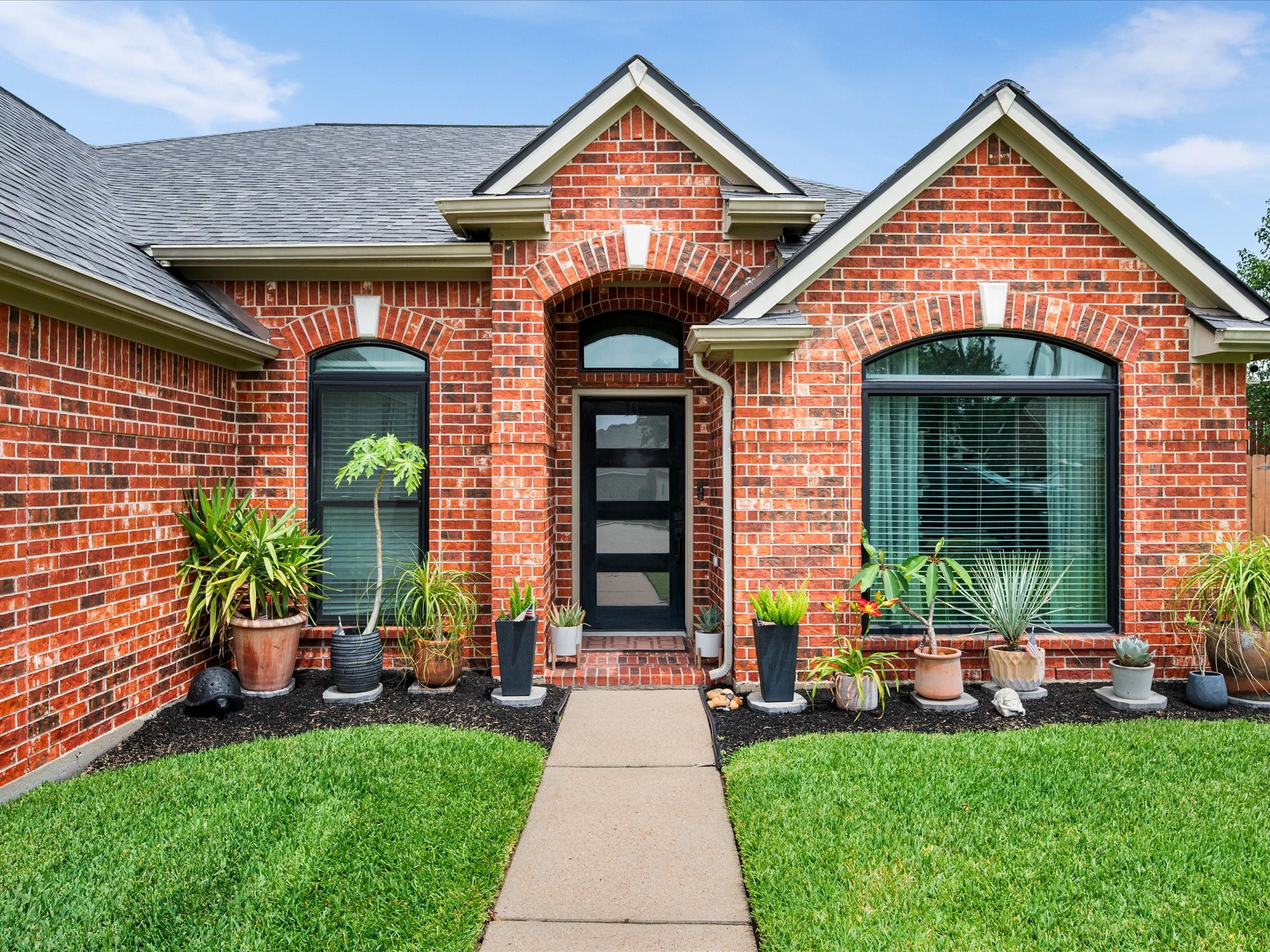 4023 Tigris Ridge Drive Katy, TX 77449 - Photo 5 of 39 The refreshed exterior is highlighted by updated windows (2021–2022) and a clean, welcoming entry with modern curb appeal.