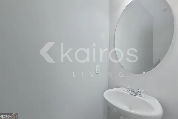 a bathroom with a sink and mirror