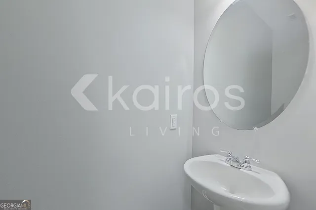 a bathroom with a sink and mirror