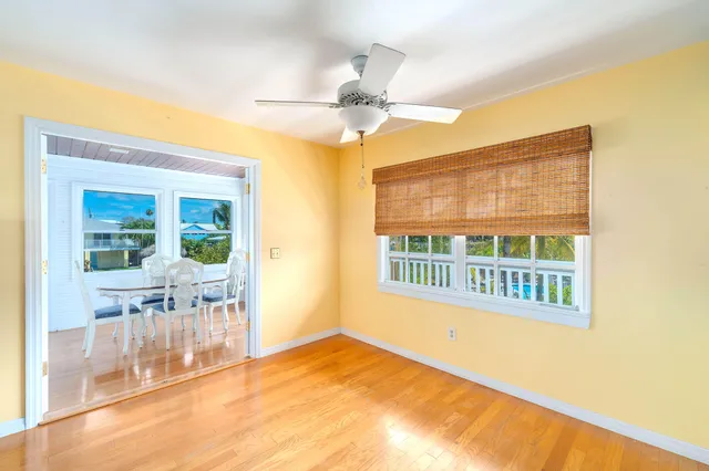 a view of an empty room with large windows