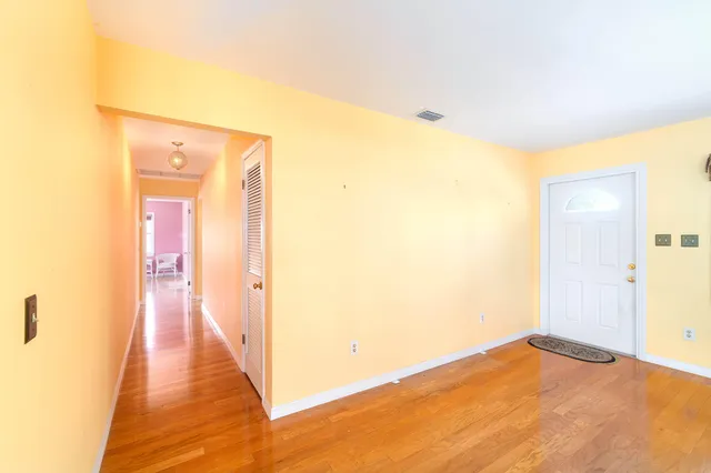 a spacious bedroom with a large bed and a window