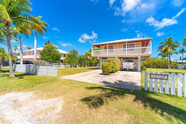 a view of a porch with a car parked in it