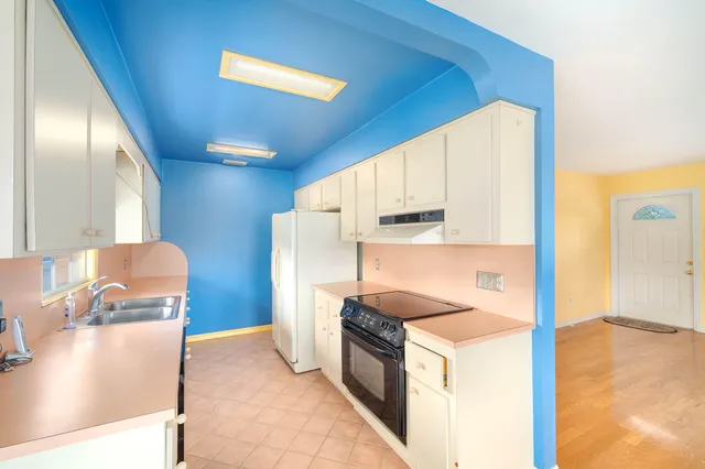 a kitchen with a sink and a window
