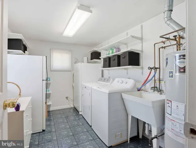a kitchen with a refrigerator and a sink