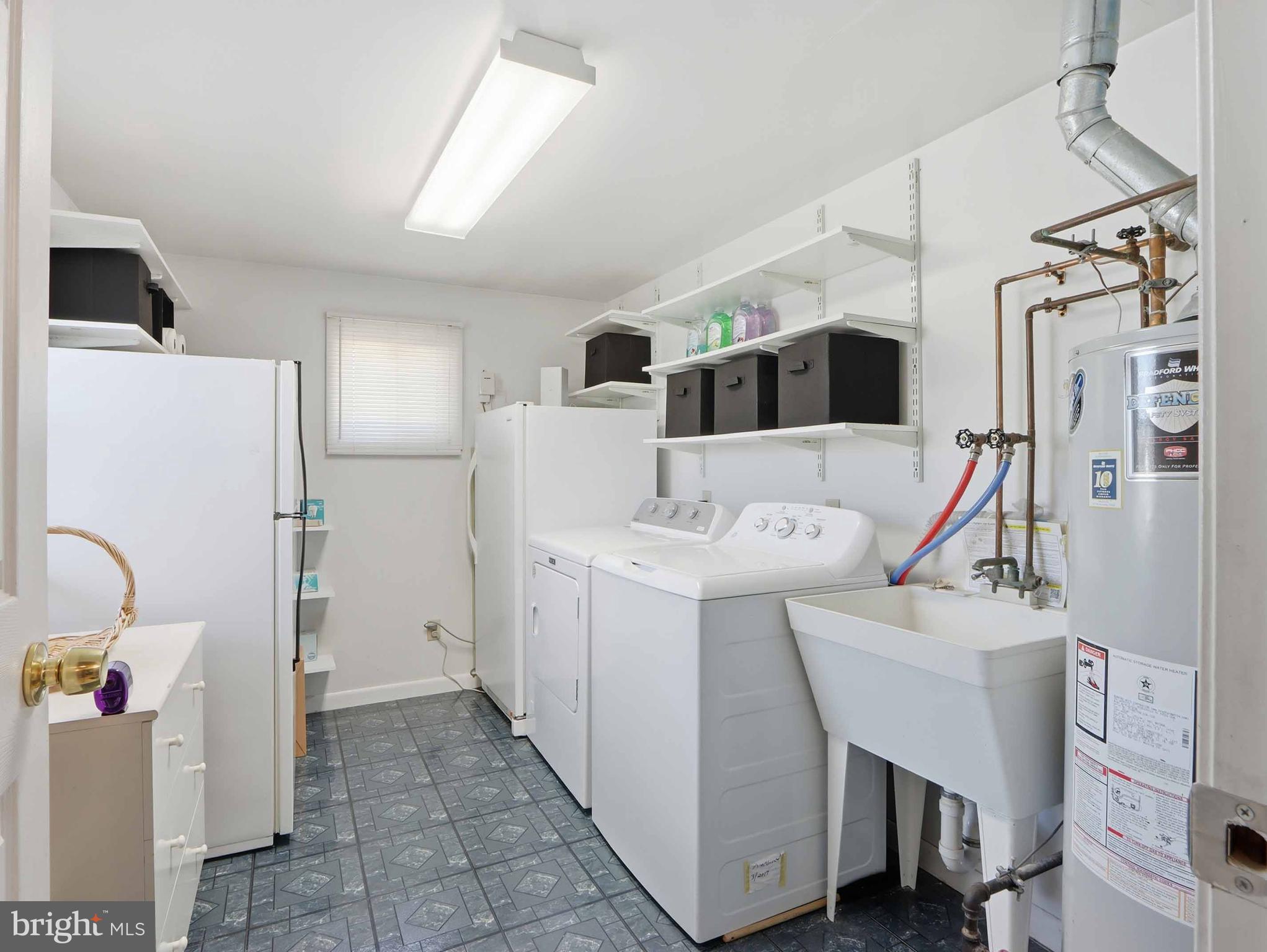 6715 Alter Street Baltimore, MD 21207 - Photo 24 of 47 Stationary tub, wash/dry, freezer and frig convey