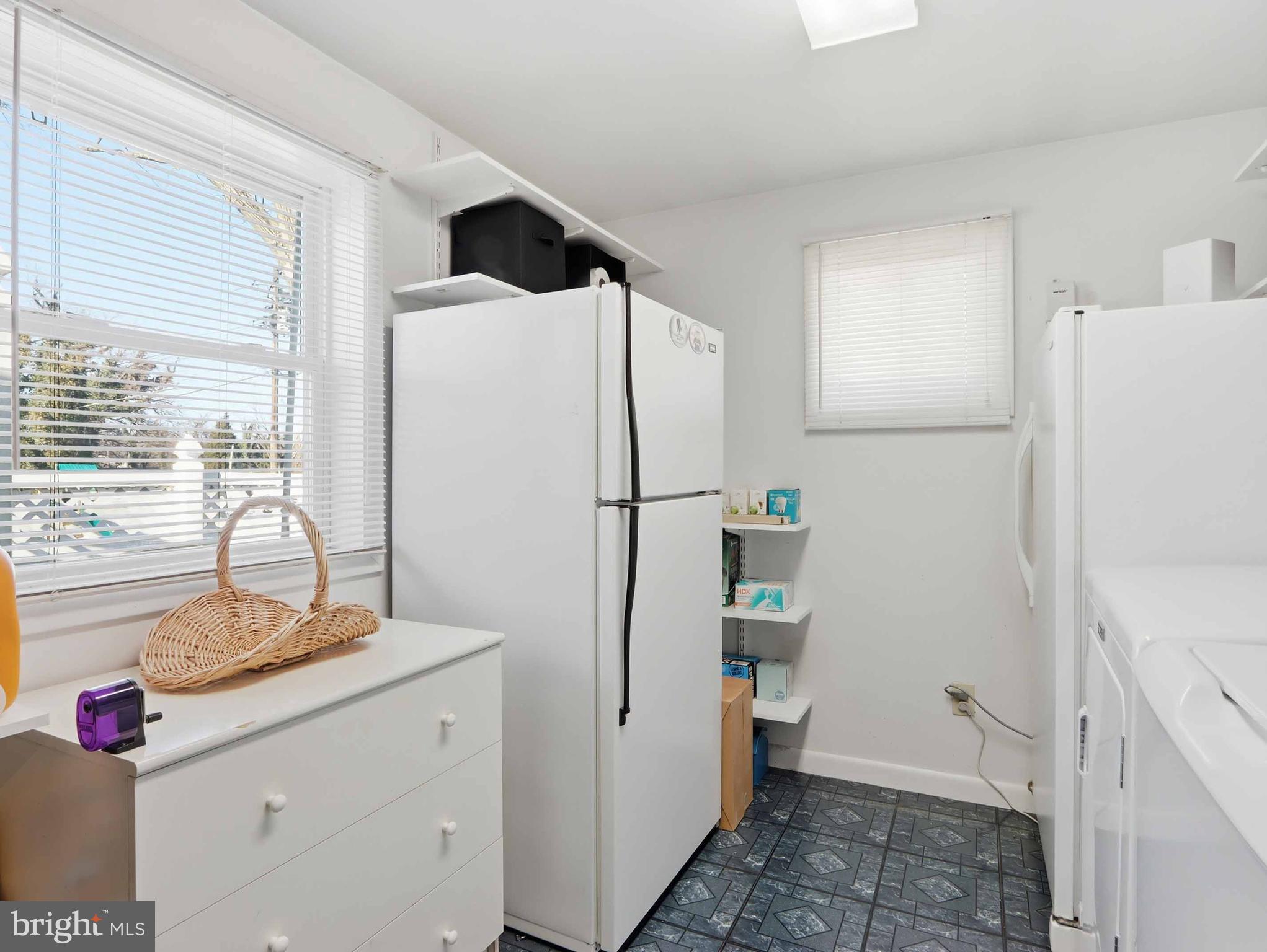 6715 Alter Street Baltimore, MD 21207 - Photo 25 of 47 laundry room-frig and freezer convey