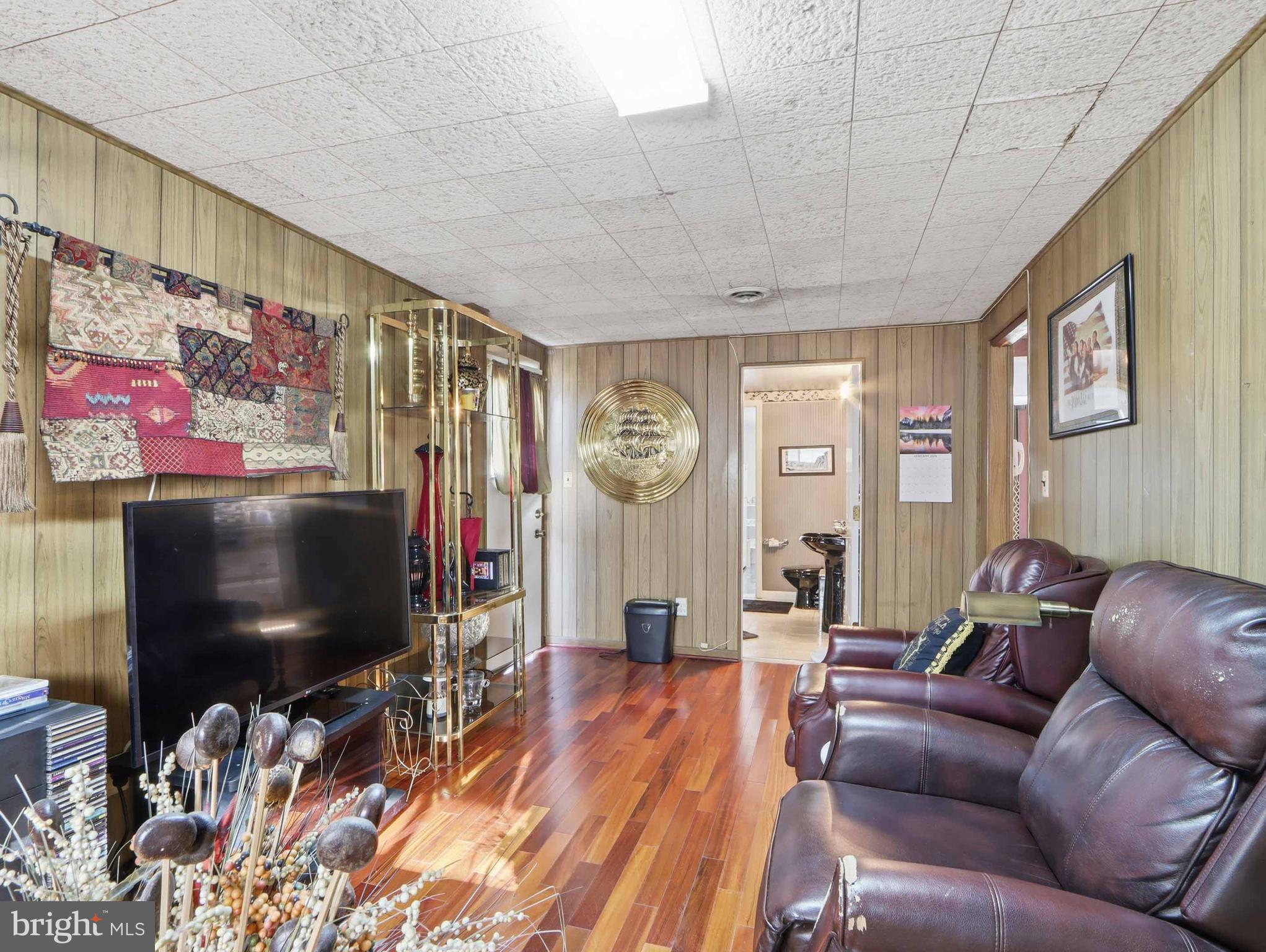 6715 Alter Street Baltimore, MD 21207 - Photo 26 of 47 Main level family room w entrance to outside