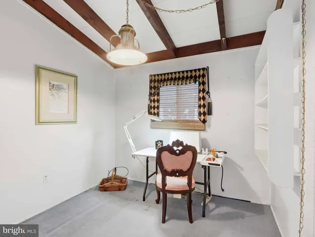 a room with furniture and gym equipment