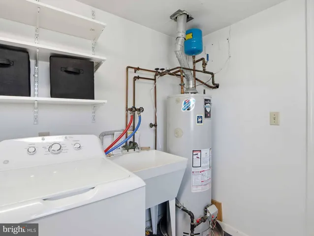 a picture of a bathroom with a shower